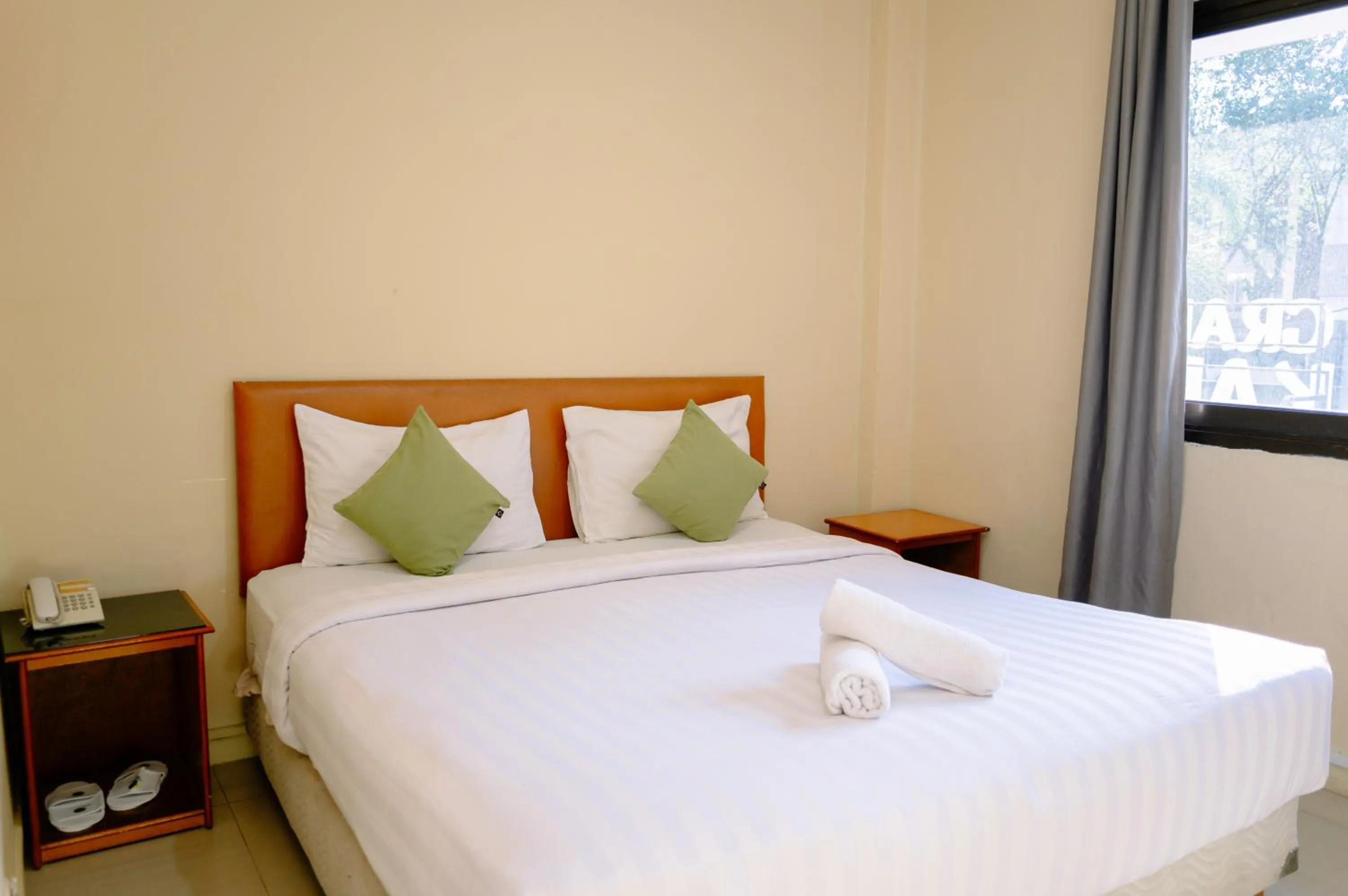 Bed in Kartika Sriwijaya Hotel