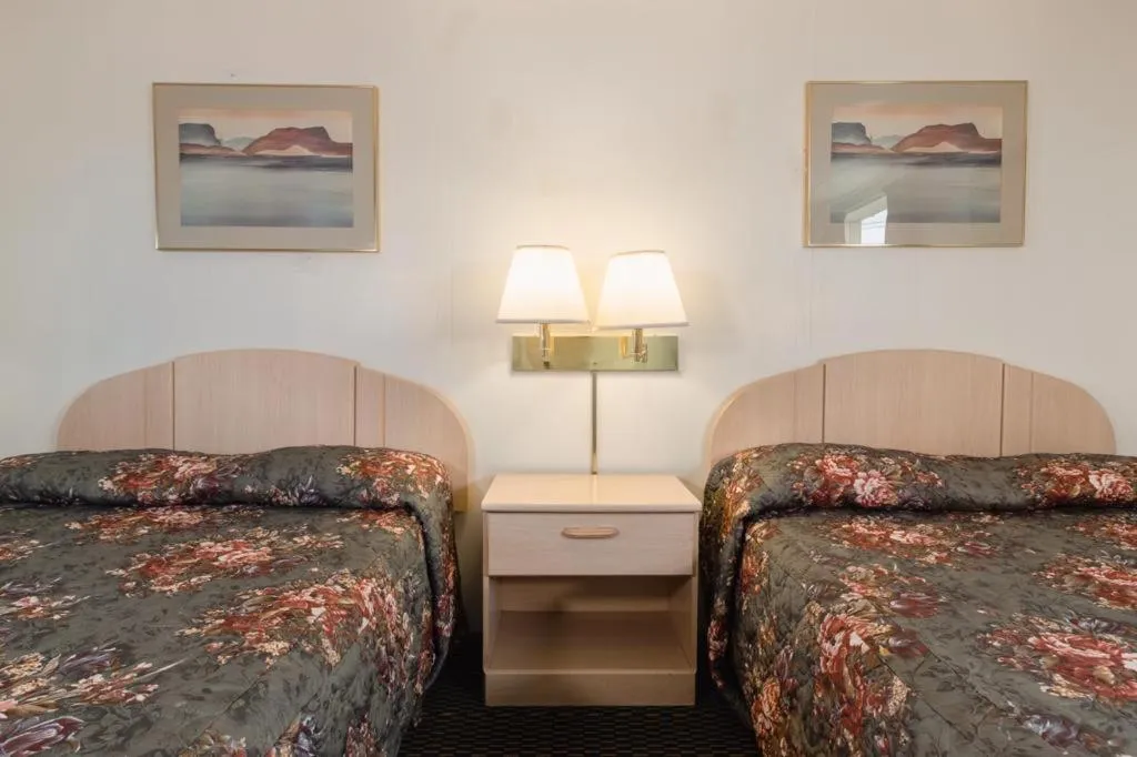 Bed in DuBois Manor Motel