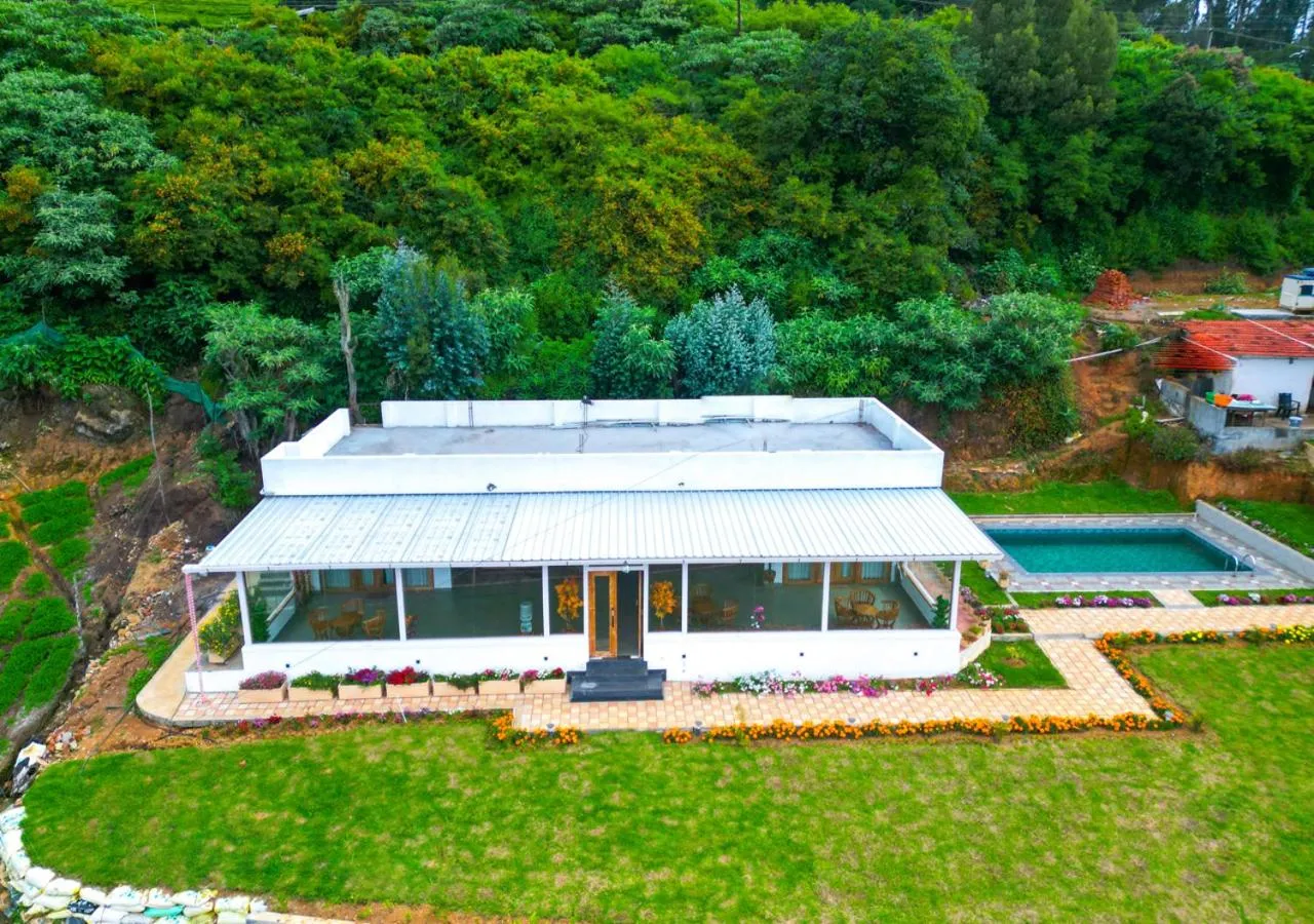 Property building in Silent Retreat Ooty Pool Resort by VOYE HOMES