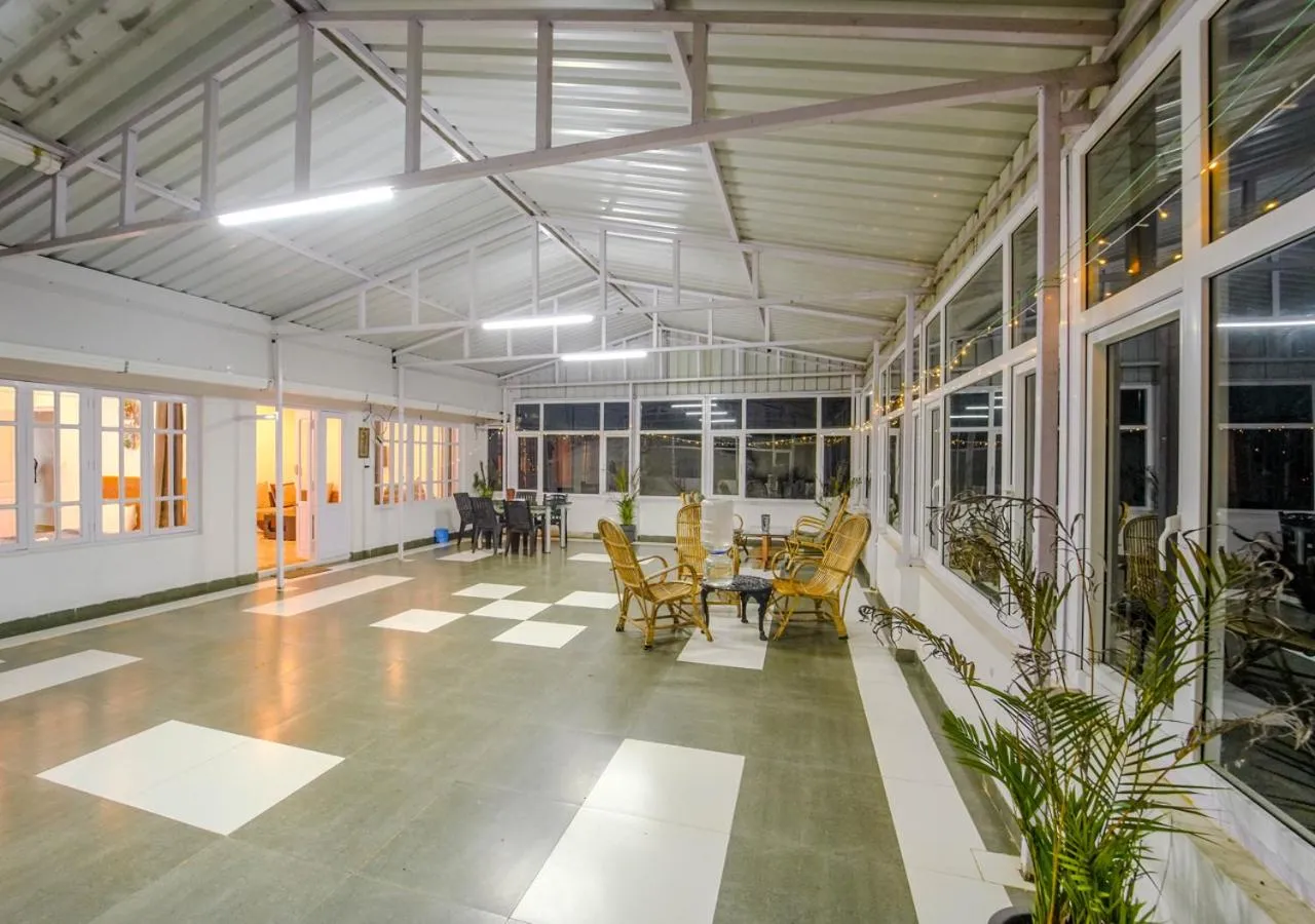 Seating area in Silent Retreat Ooty Pool Resort by VOYE HOMES