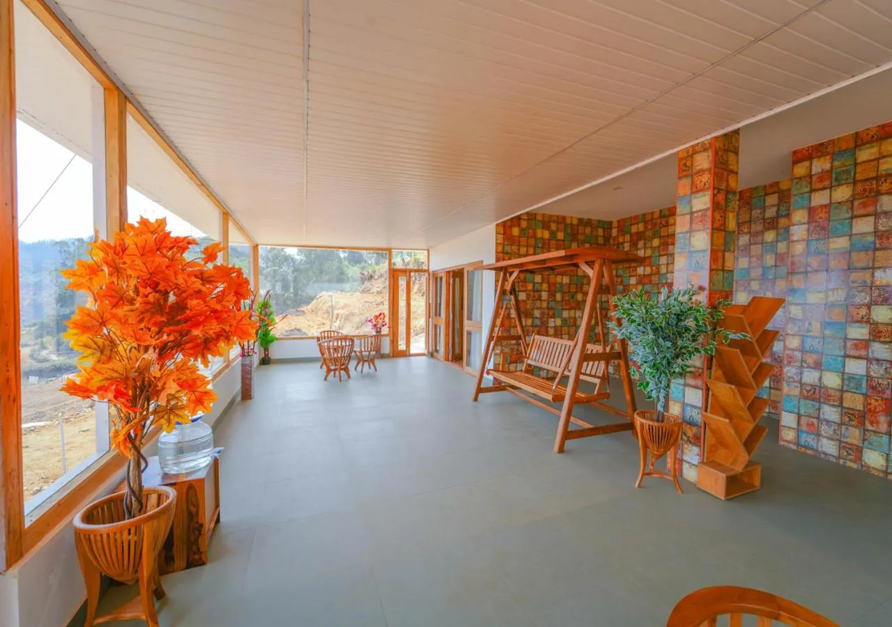 Living room in Silent Retreat Ooty Pool Resort by VOYE HOMES