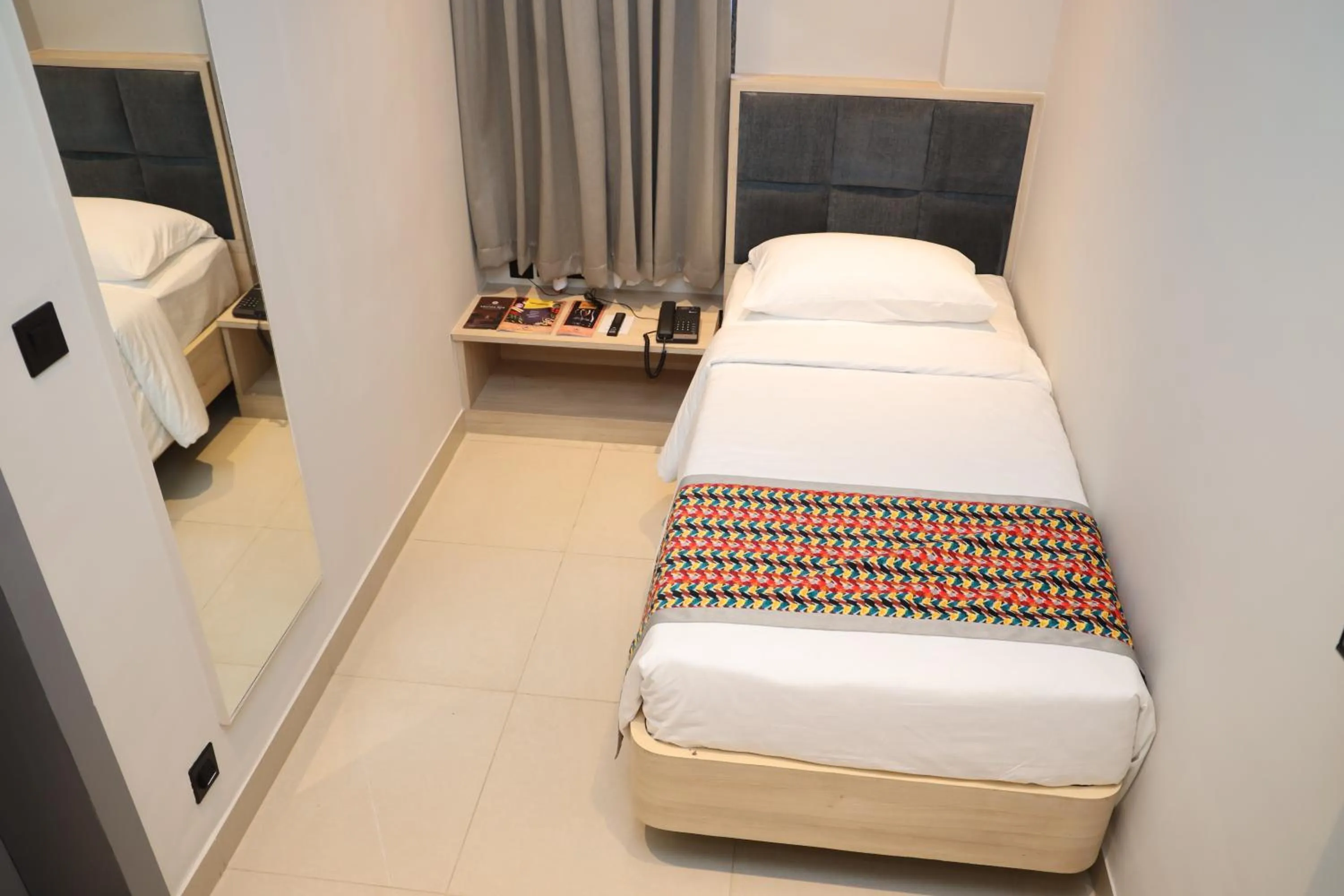 Bed in The Citi Residenci Hotel, Banskopa