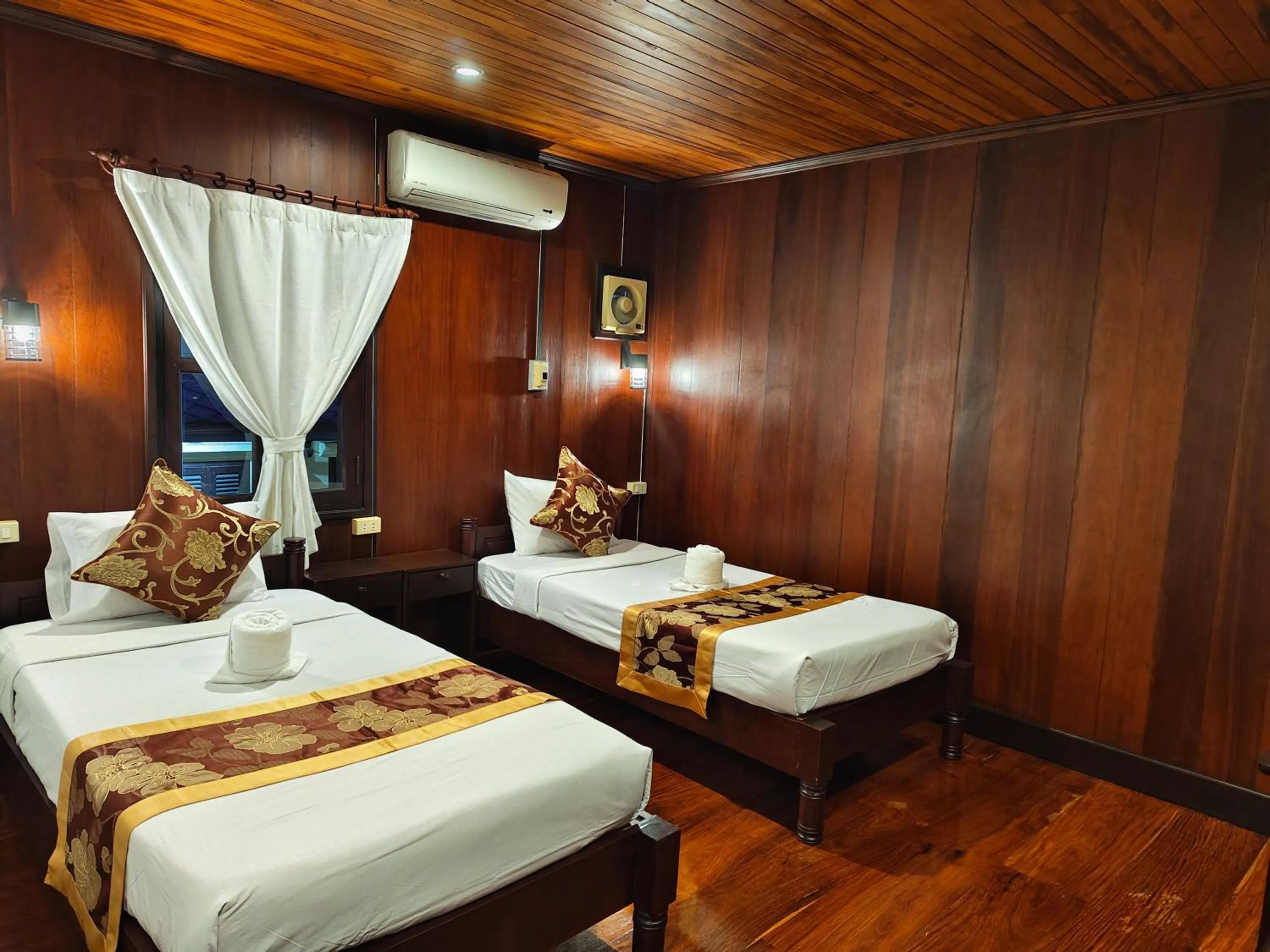 Bed in Bouakham Chanthasack Guesthouse