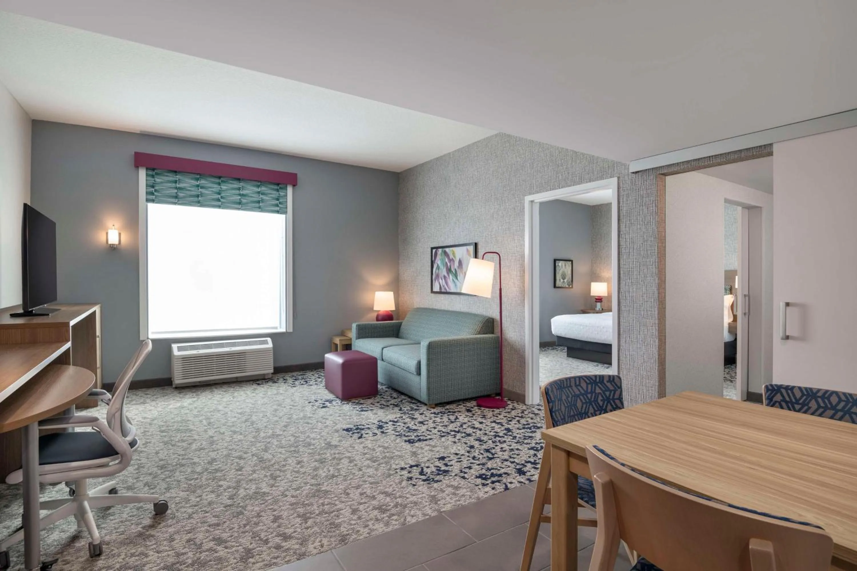 Living room, Bed in Home2 Suites By Hilton Sanford Orlando North