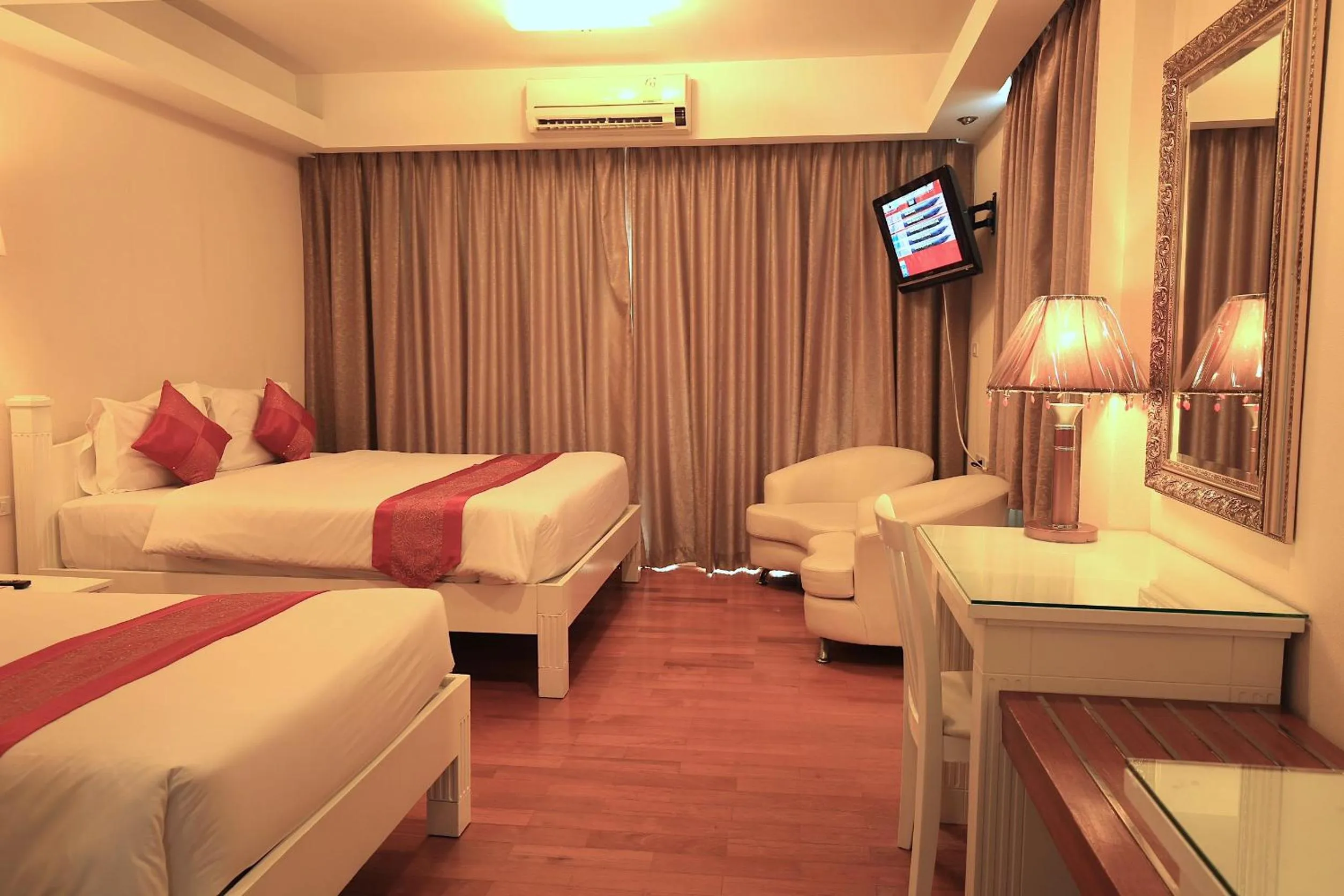 Bed in Grandsmile Wellness Resort