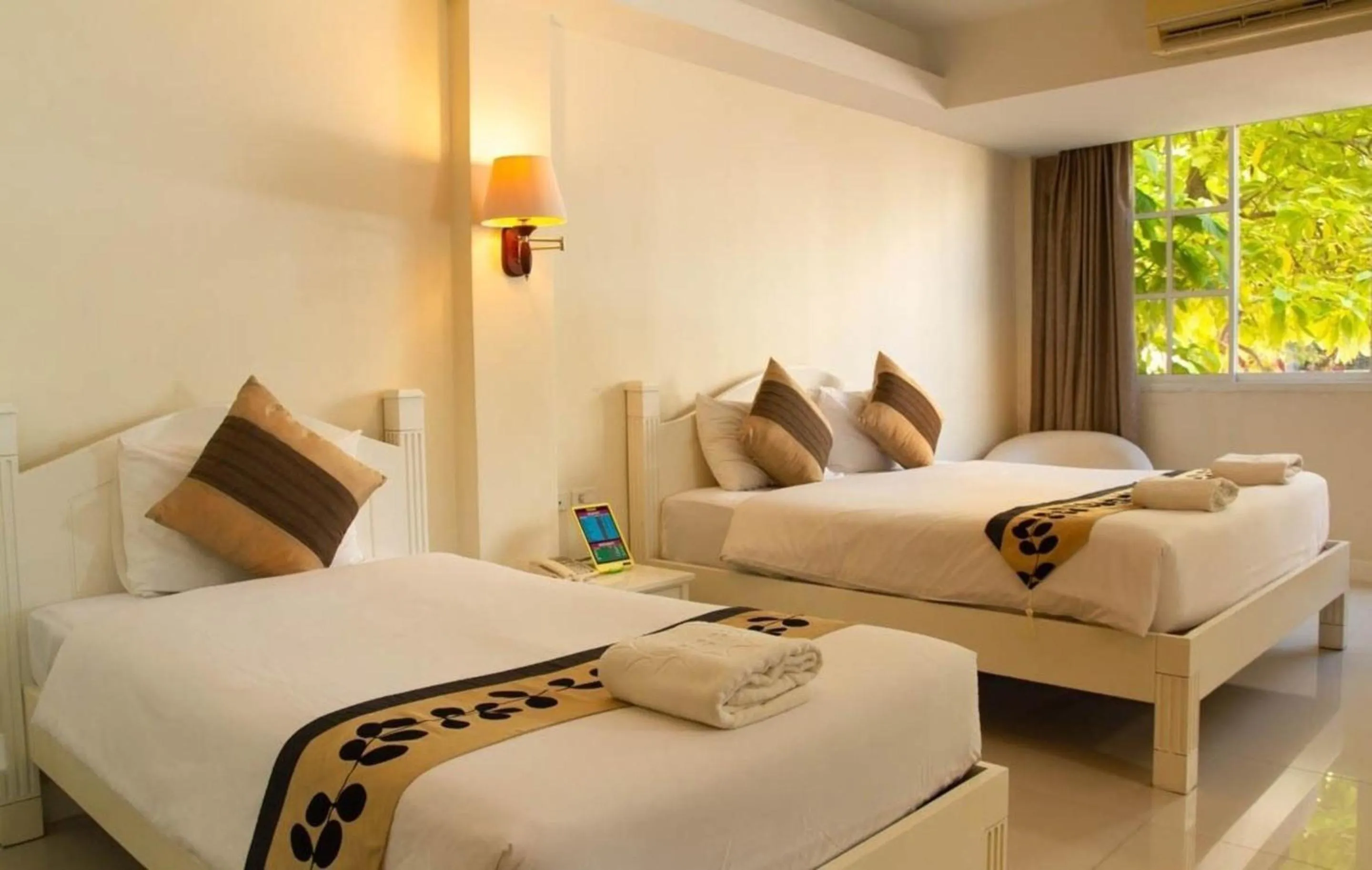 Bed in Grandsmile Wellness Resort