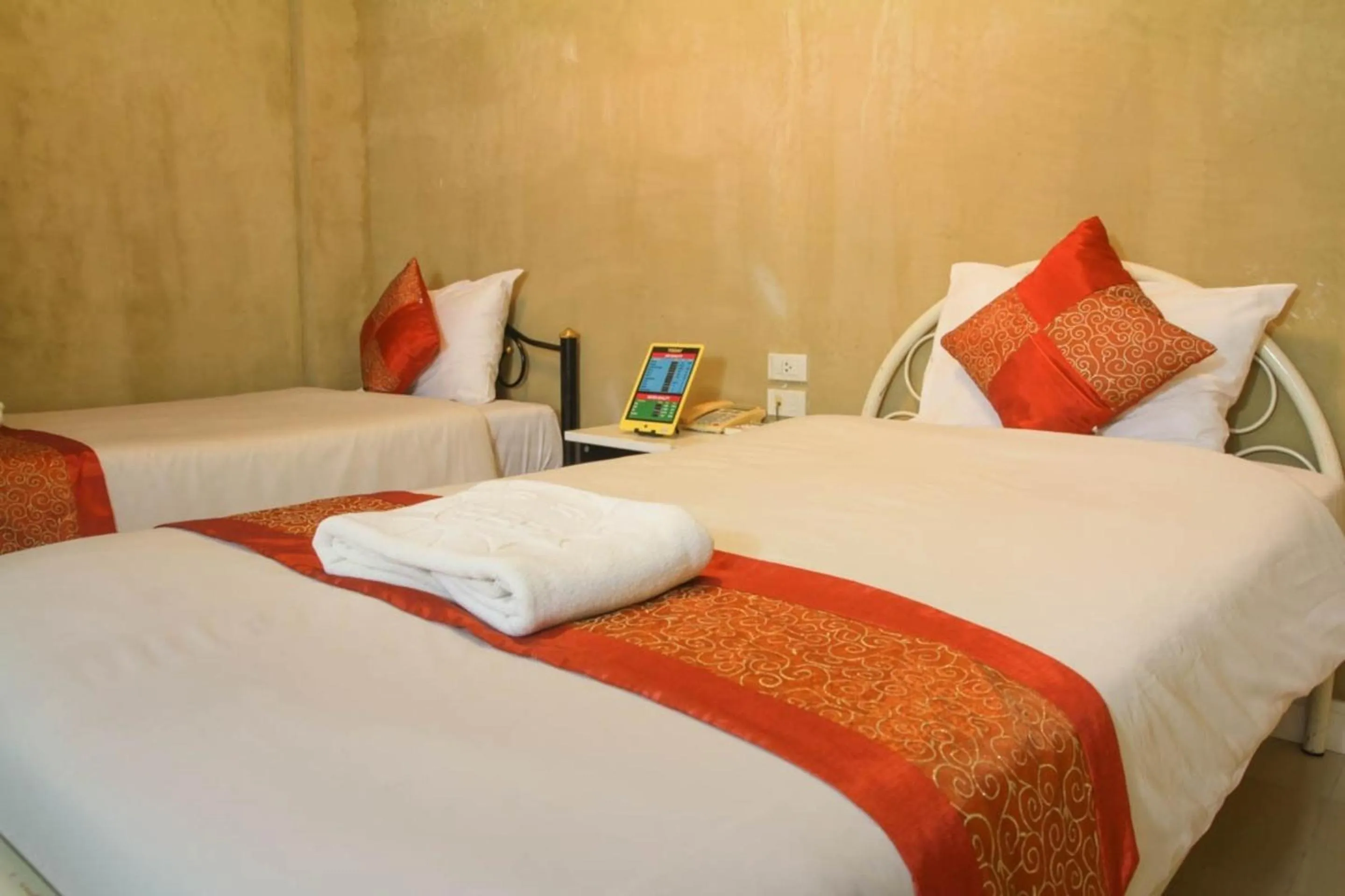 Bed in Grandsmile Wellness Resort