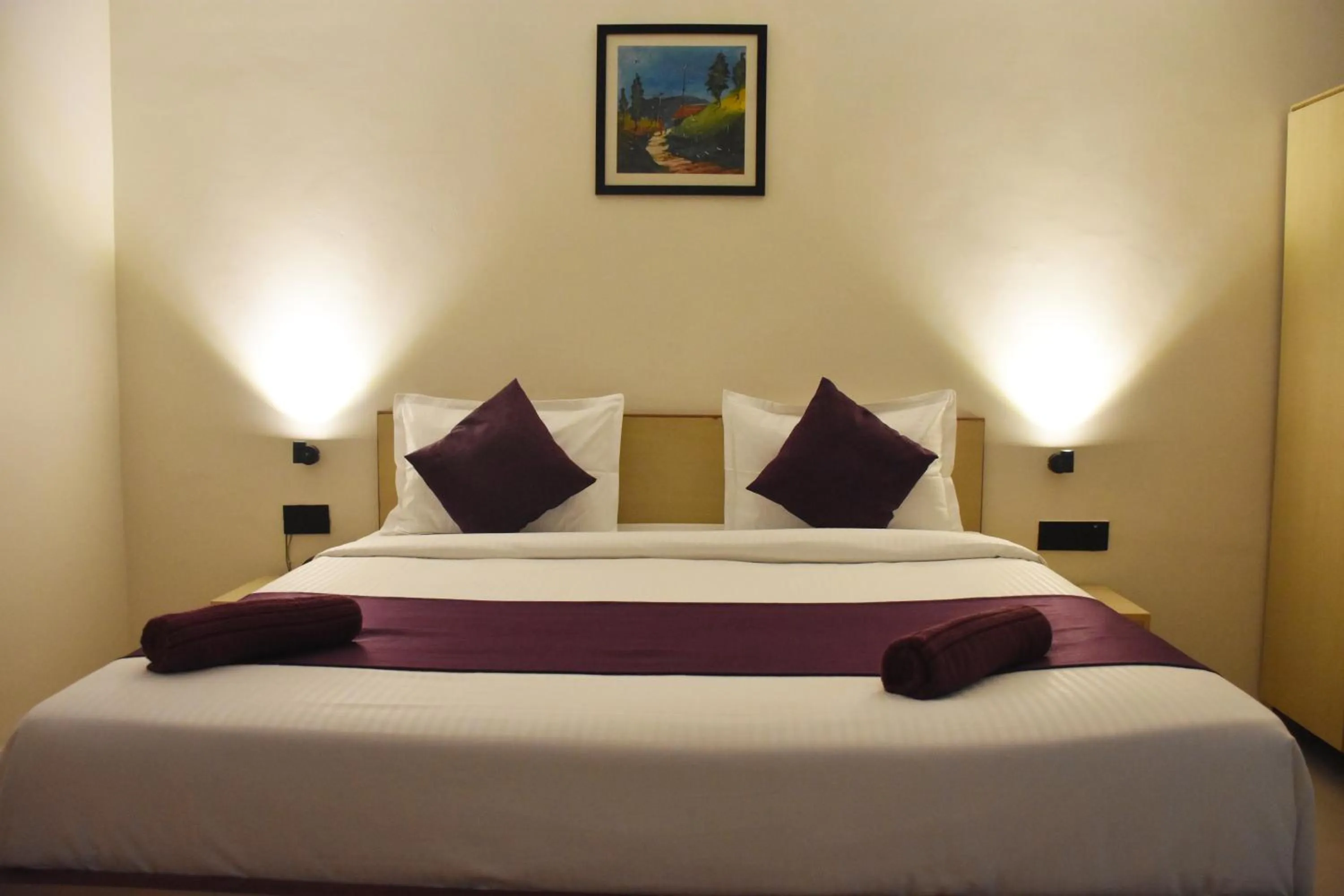 Bed in Date Palm Hotel