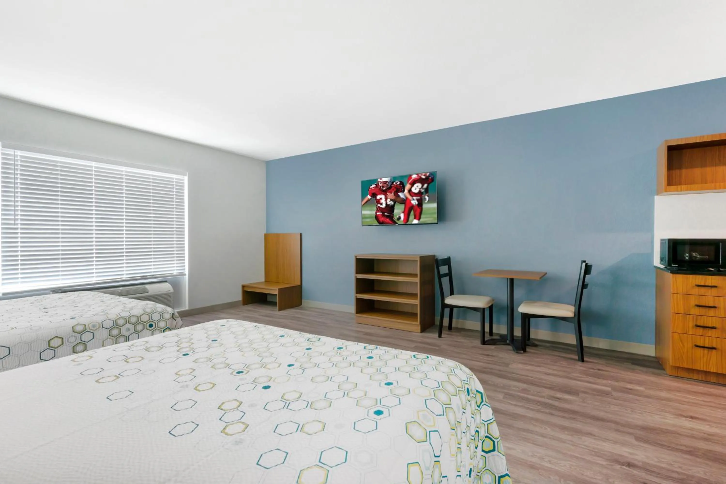 Bedroom, Bed in HomeTowne Studios by Red Roof Tampa - Airport