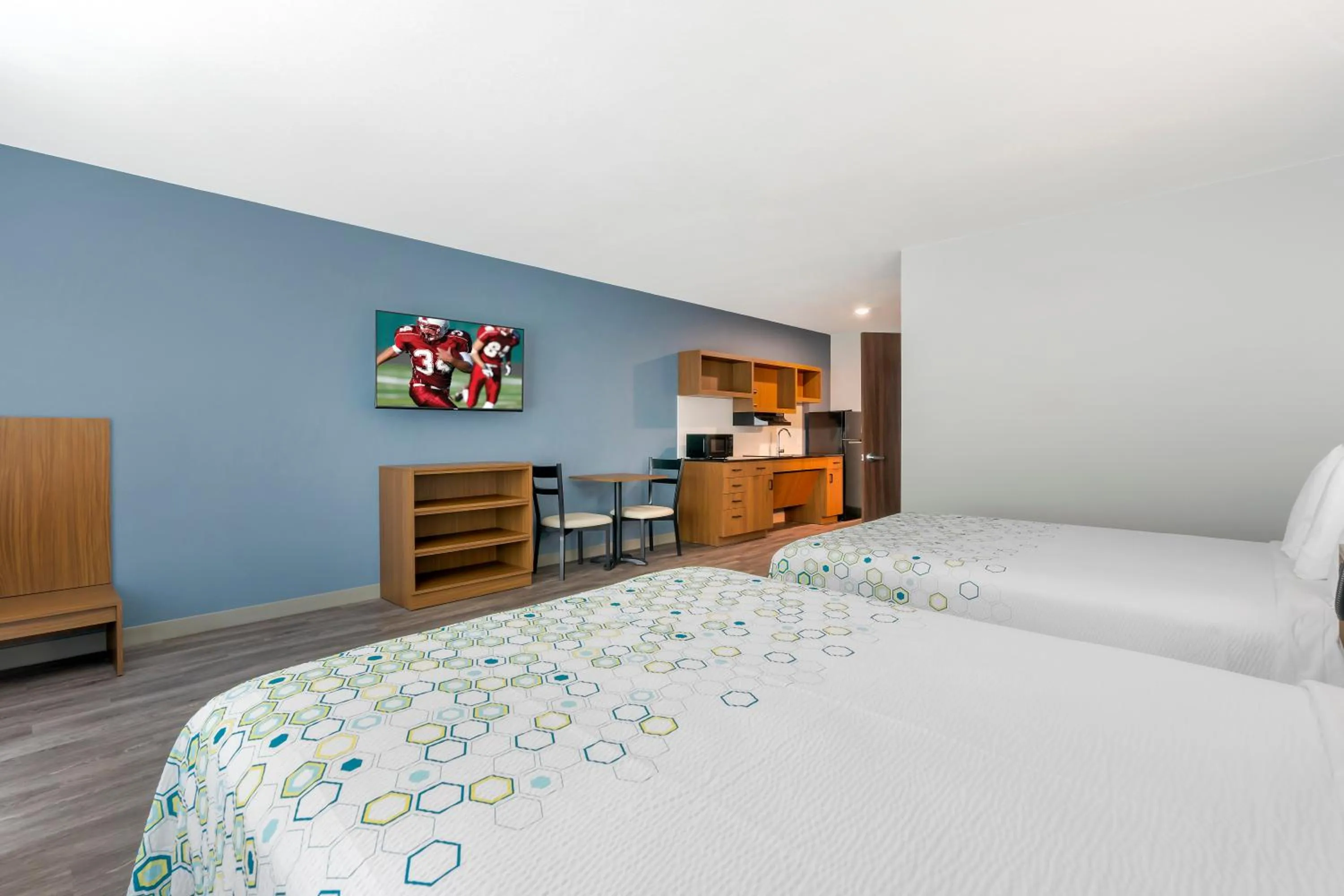Bedroom, Bed in HomeTowne Studios by Red Roof Tampa - Airport