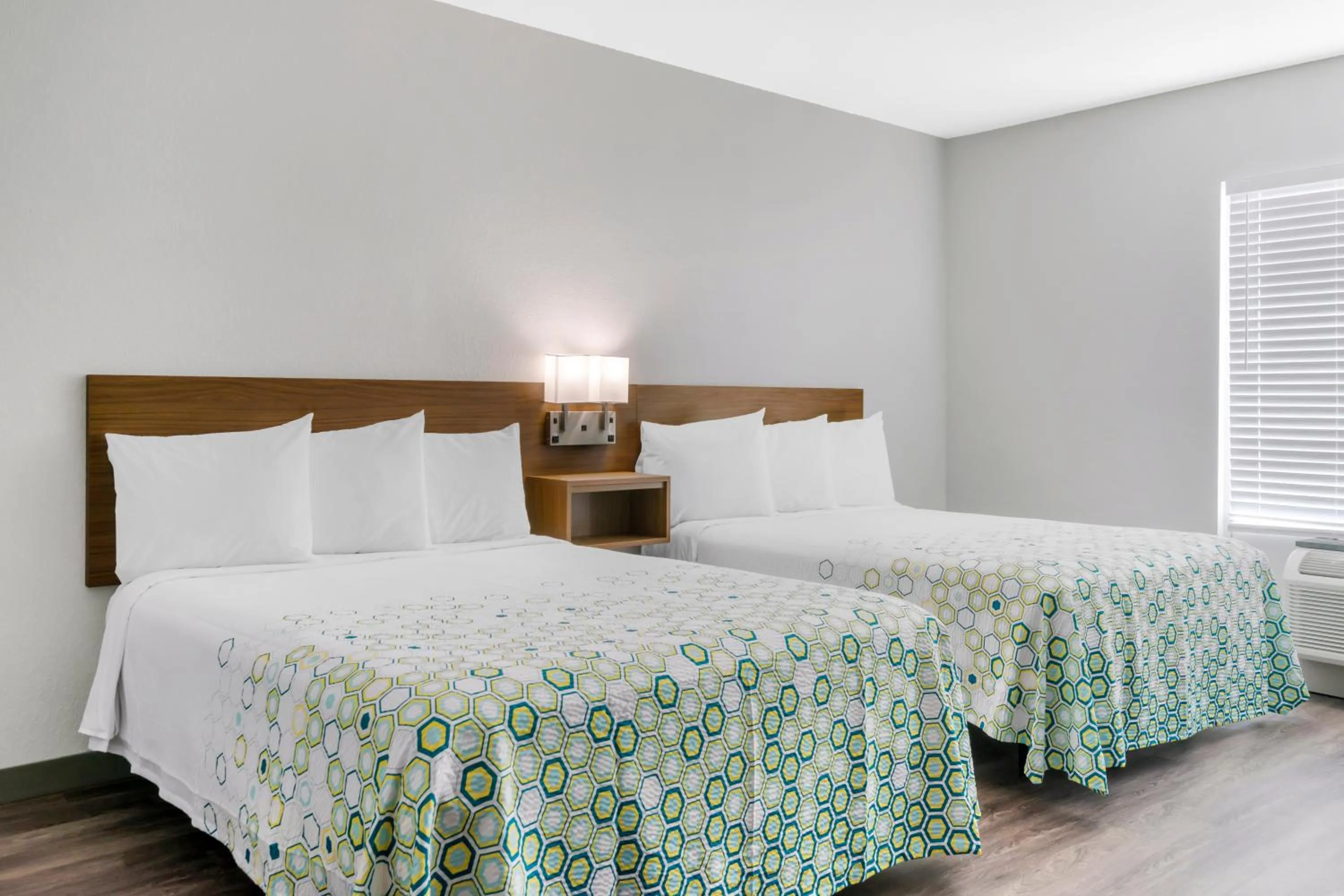 Bedroom, Bed in HomeTowne Studios by Red Roof Tampa - Airport