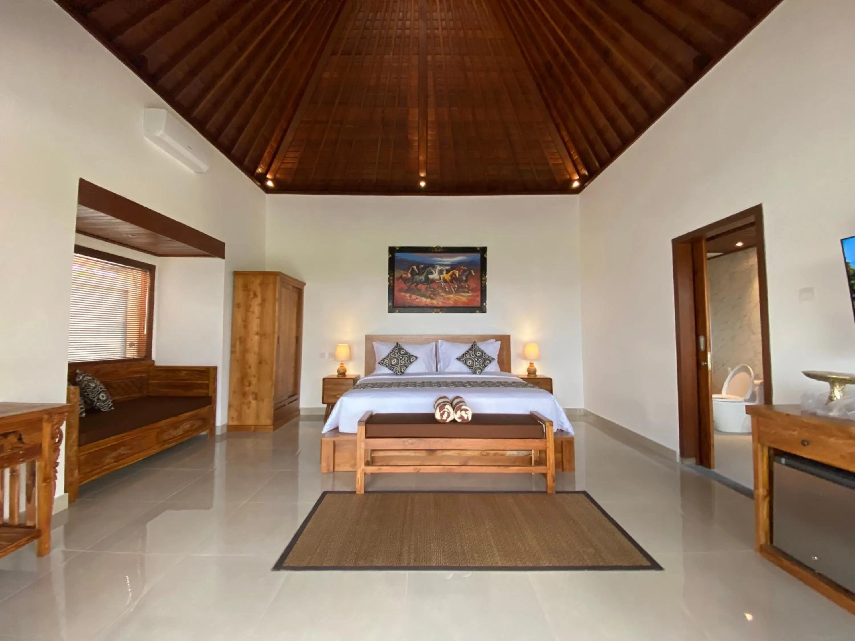 Bed in Kaki Uma Villa