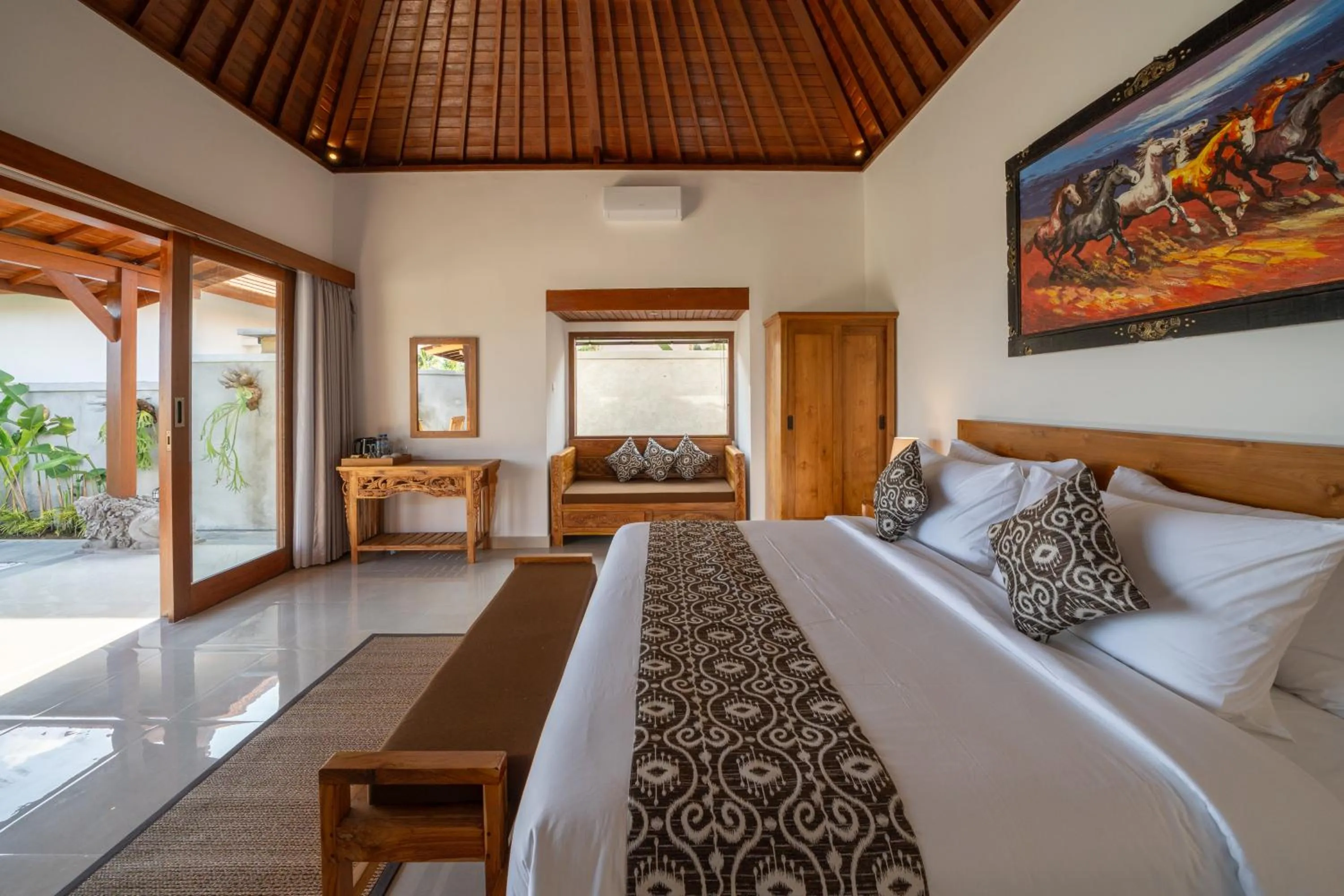 Bed in Kaki Uma Villa