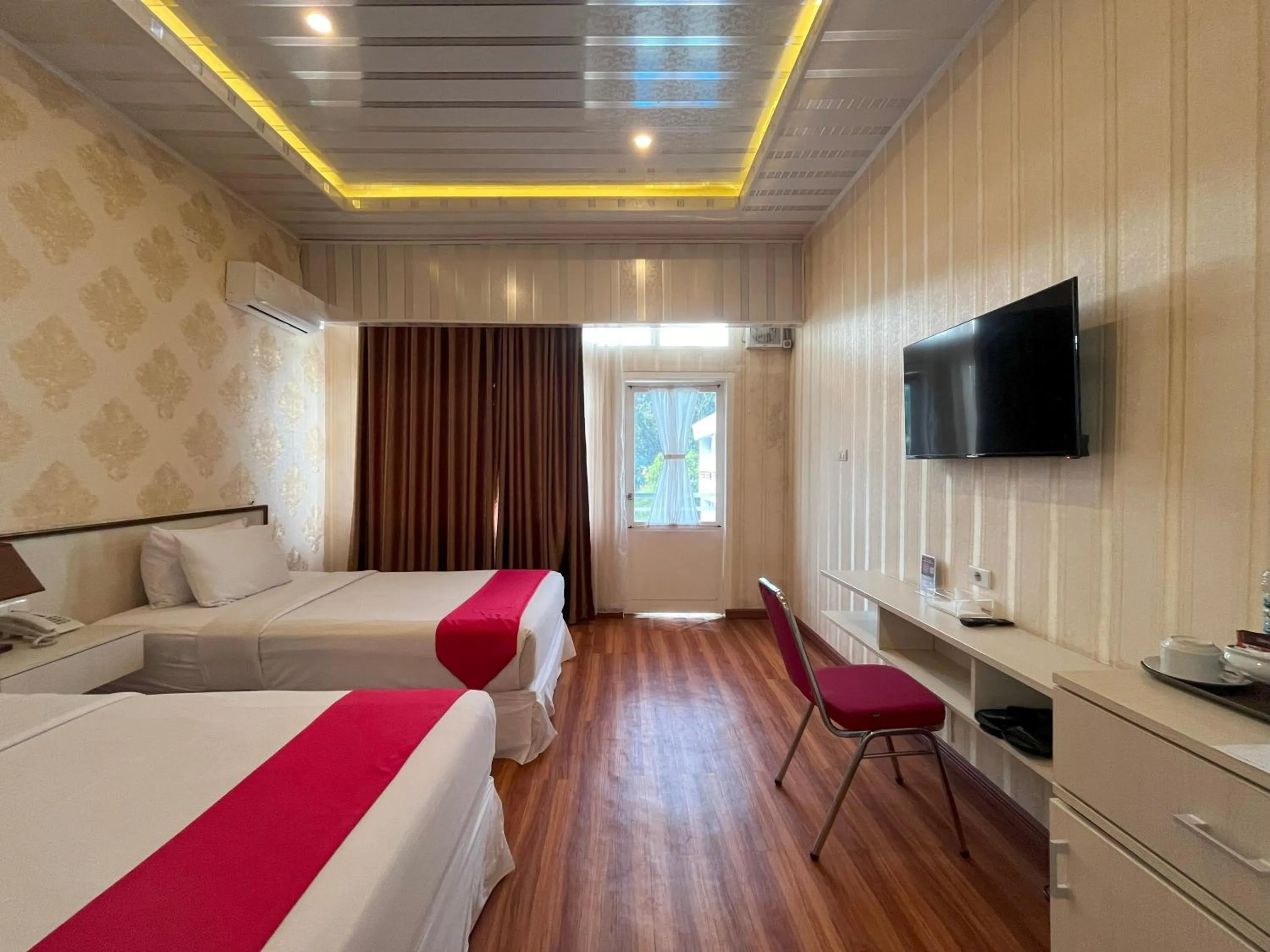 Bed in Grand Tamaro Hotel