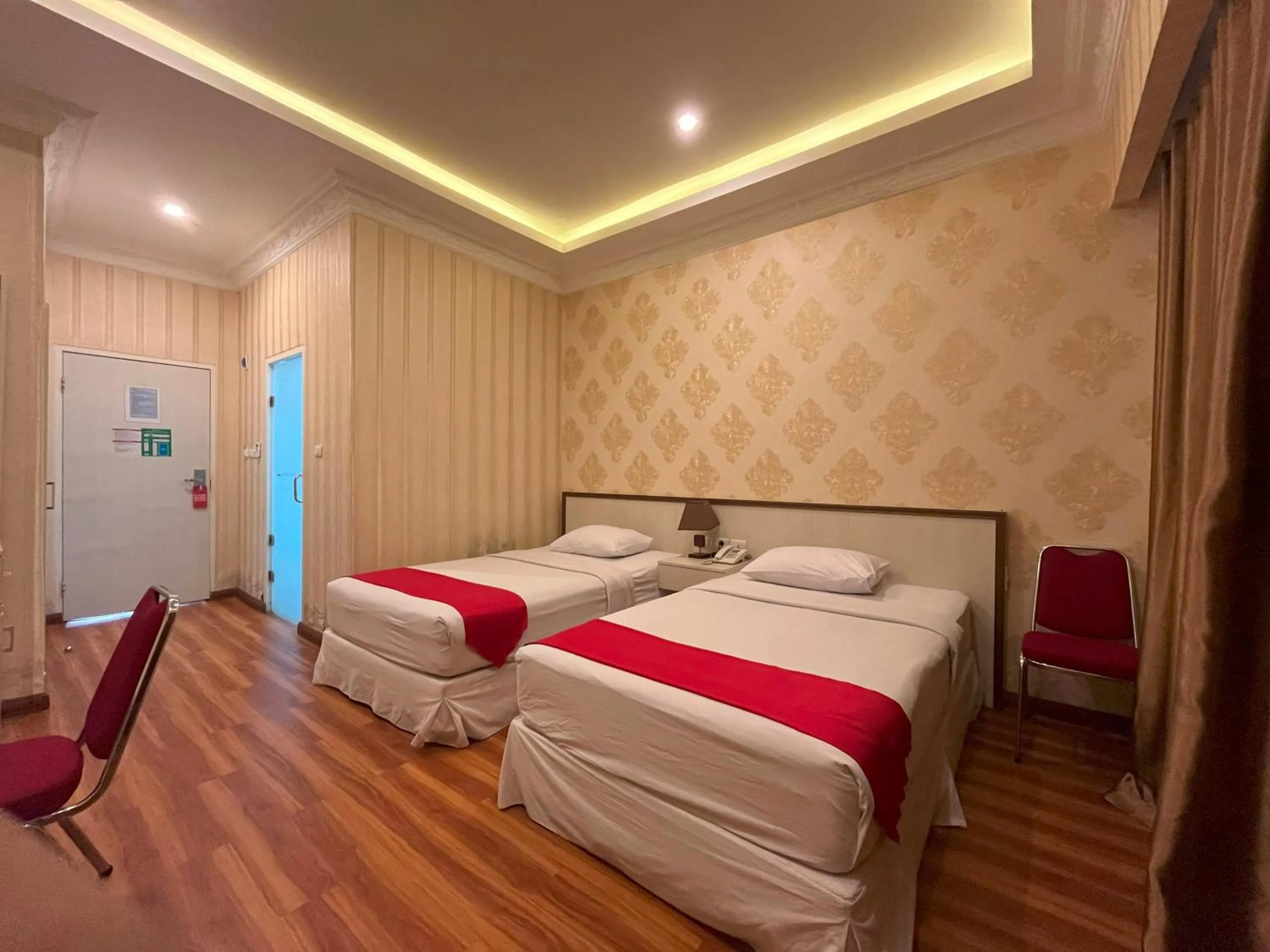 Bed in Grand Tamaro Hotel