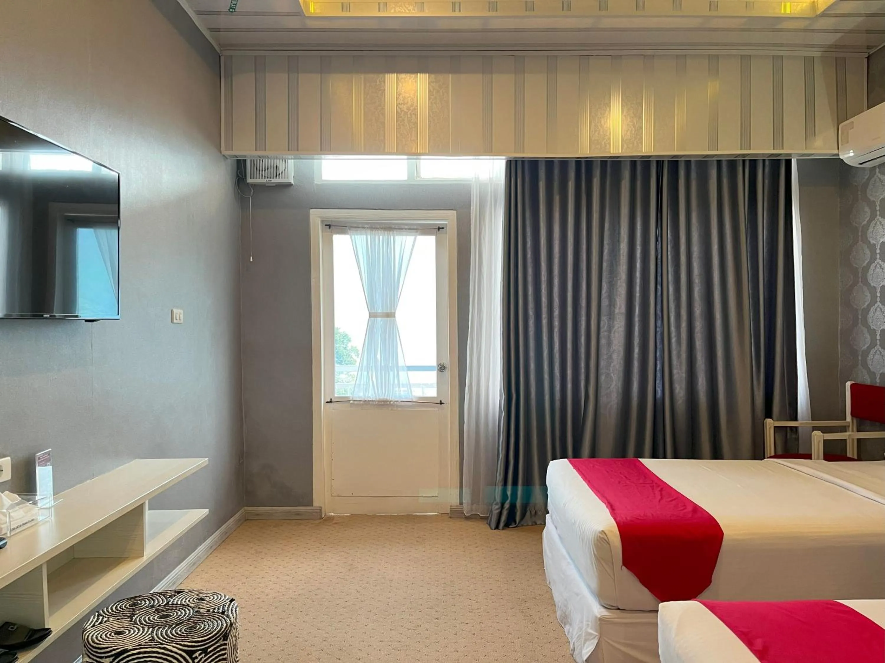 Bed in Grand Tamaro Hotel