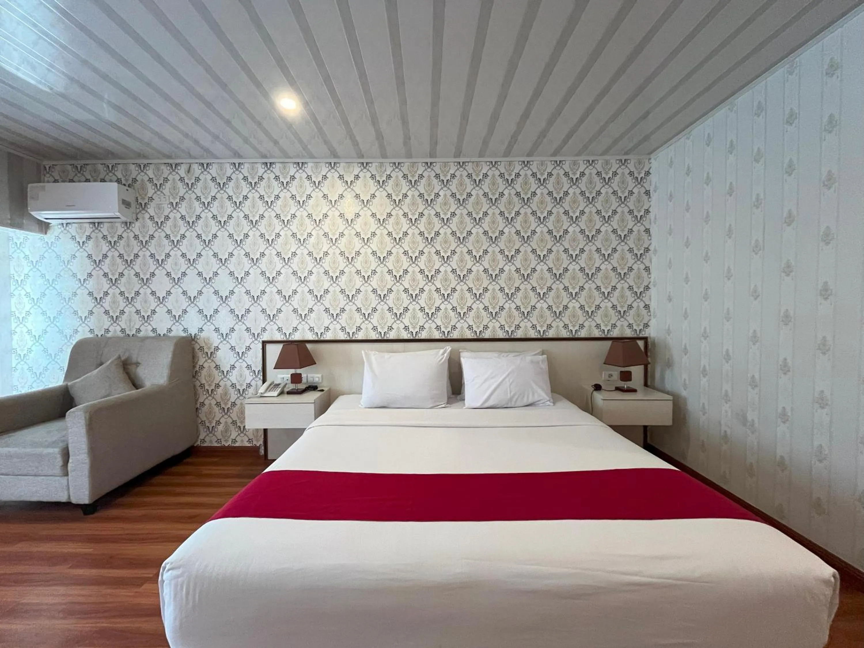 Bed in Grand Tamaro Hotel