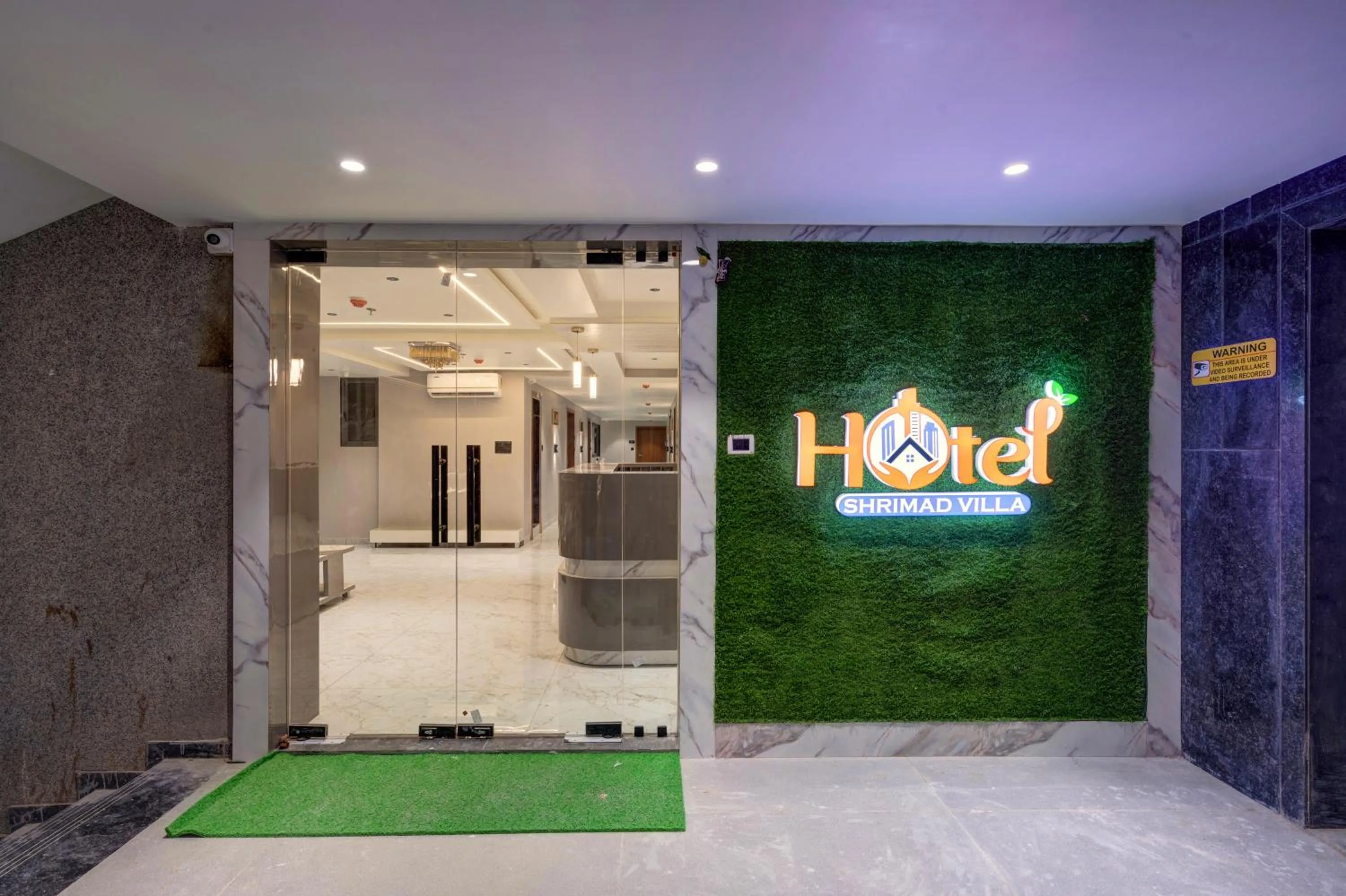 Property logo or sign in Hotel Shrimad Villa Gandhinagar