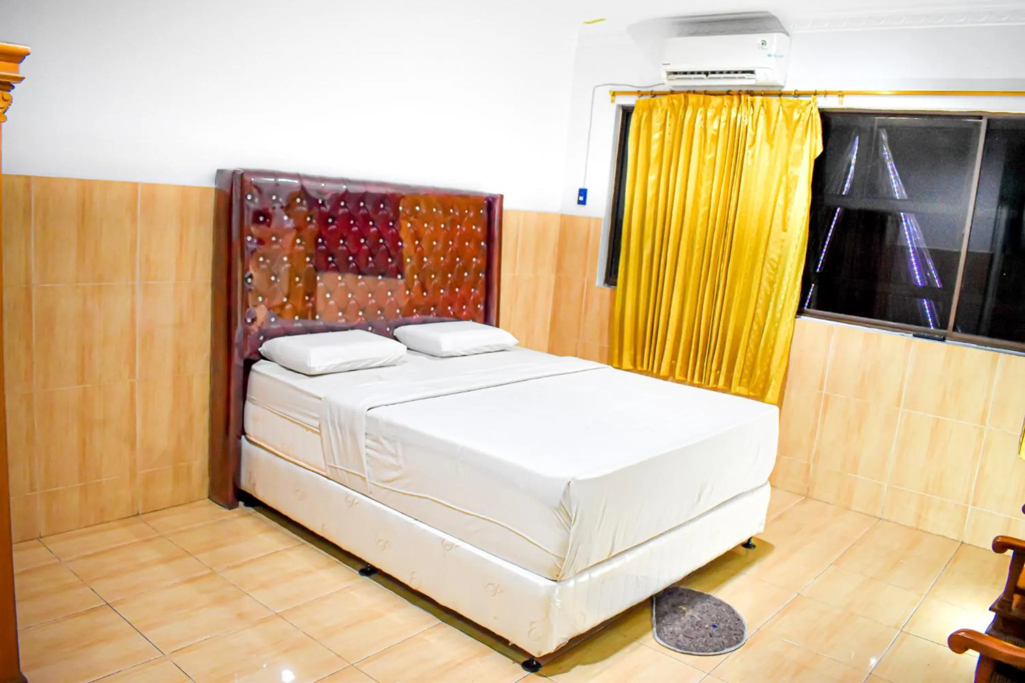 Bed in Hotel Grand Bandara