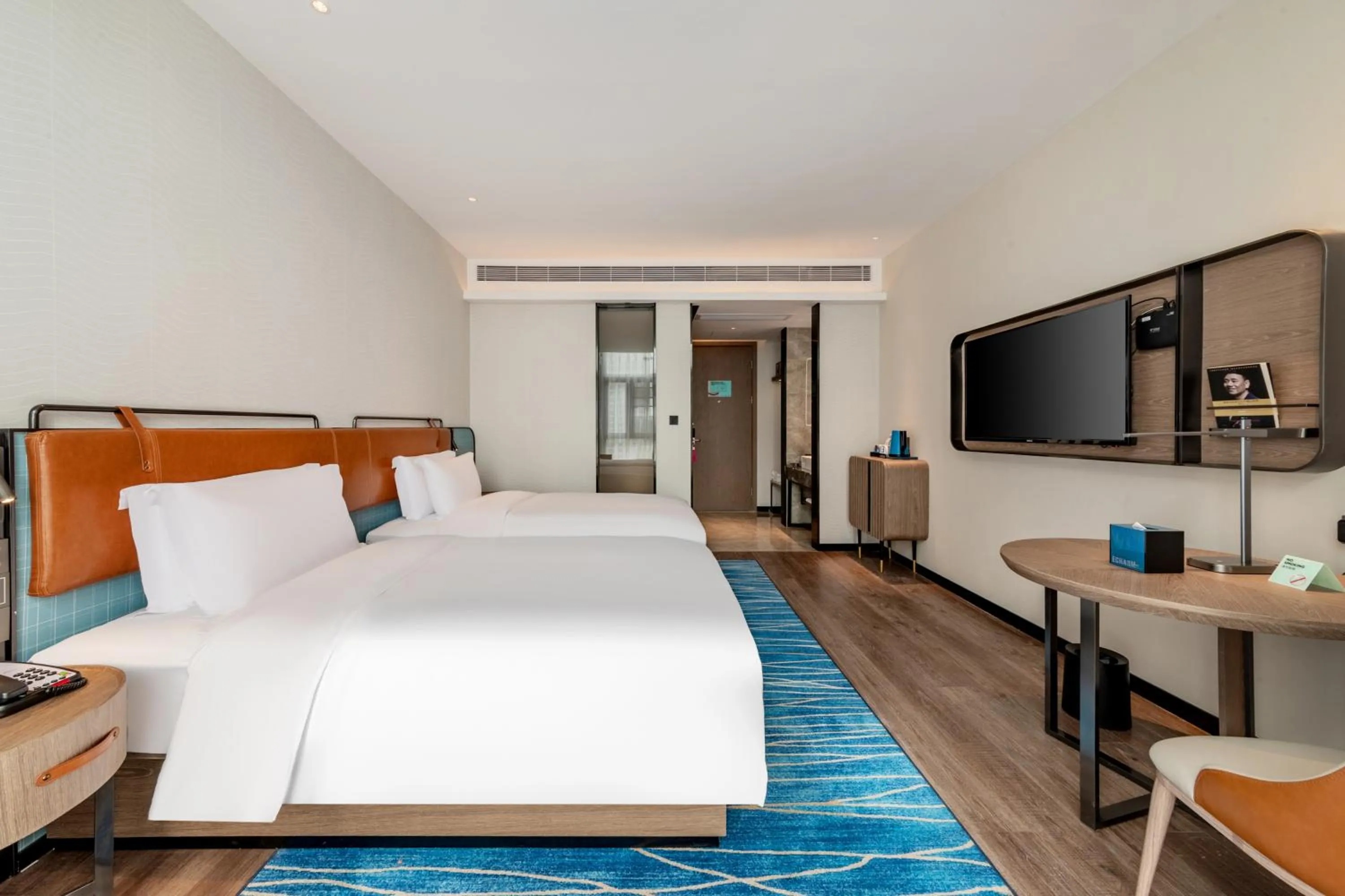 Photo of the whole room, Bed in Echarm Hotel Yichang East Railway Station