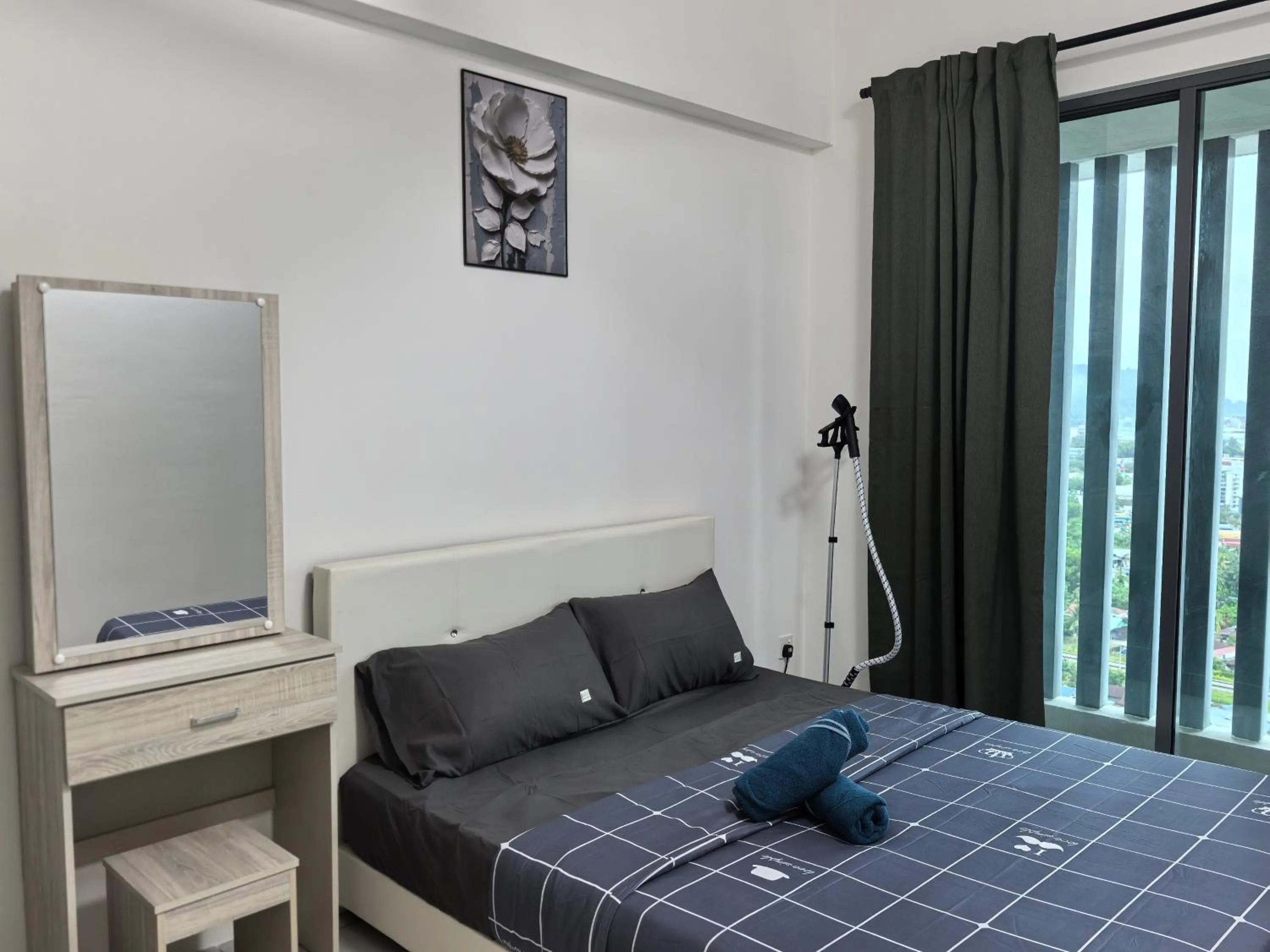 Bed in Bahagia Family House in Meritus