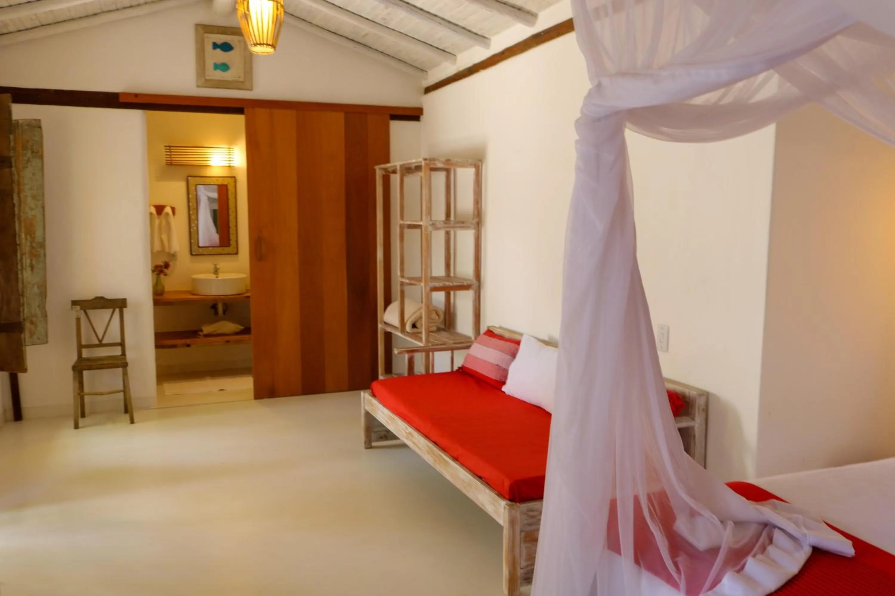 Bed in Pousada Hibisco