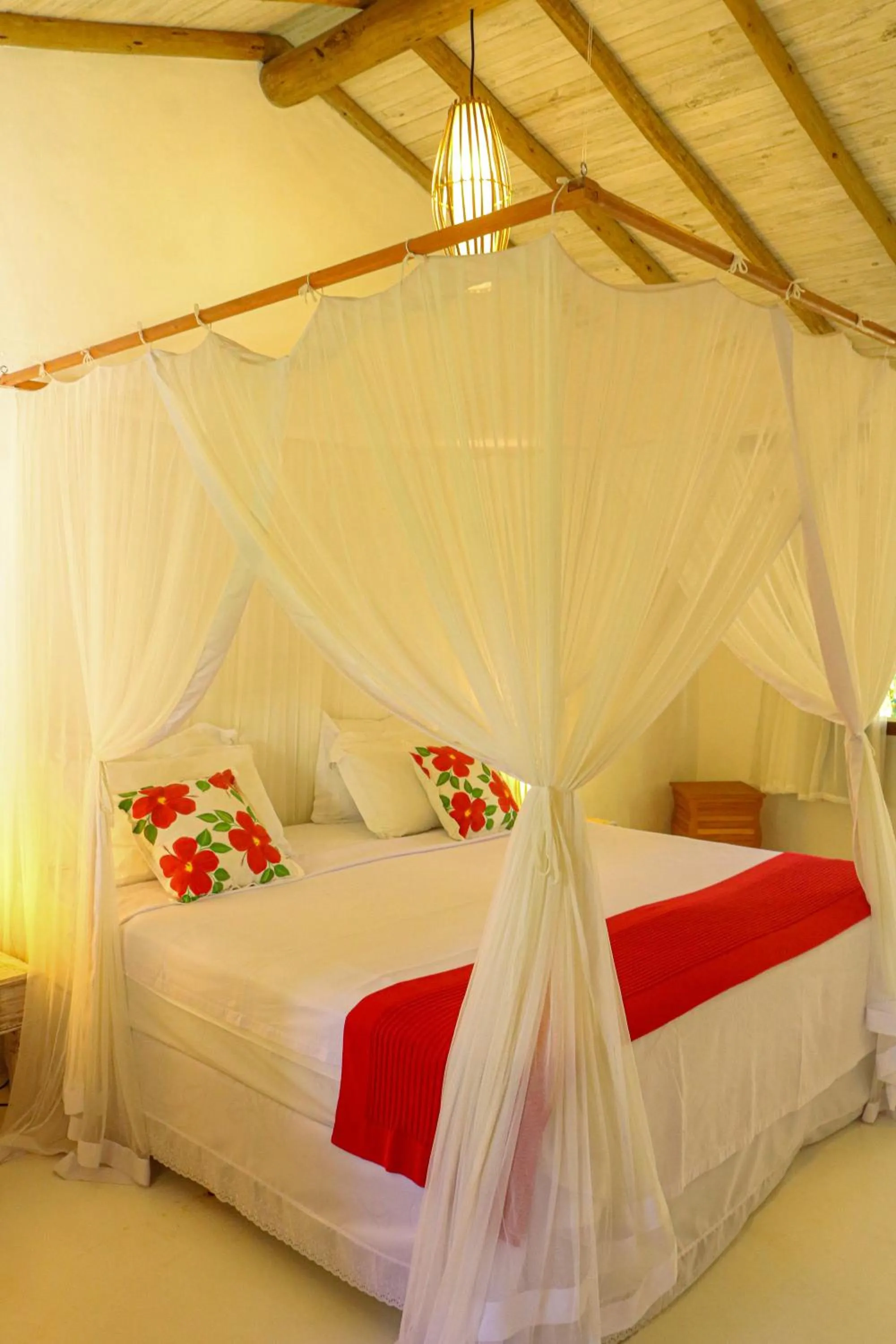 Bed in Pousada Hibisco