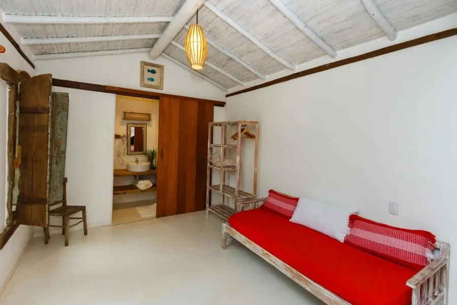 Bed in Pousada Hibisco