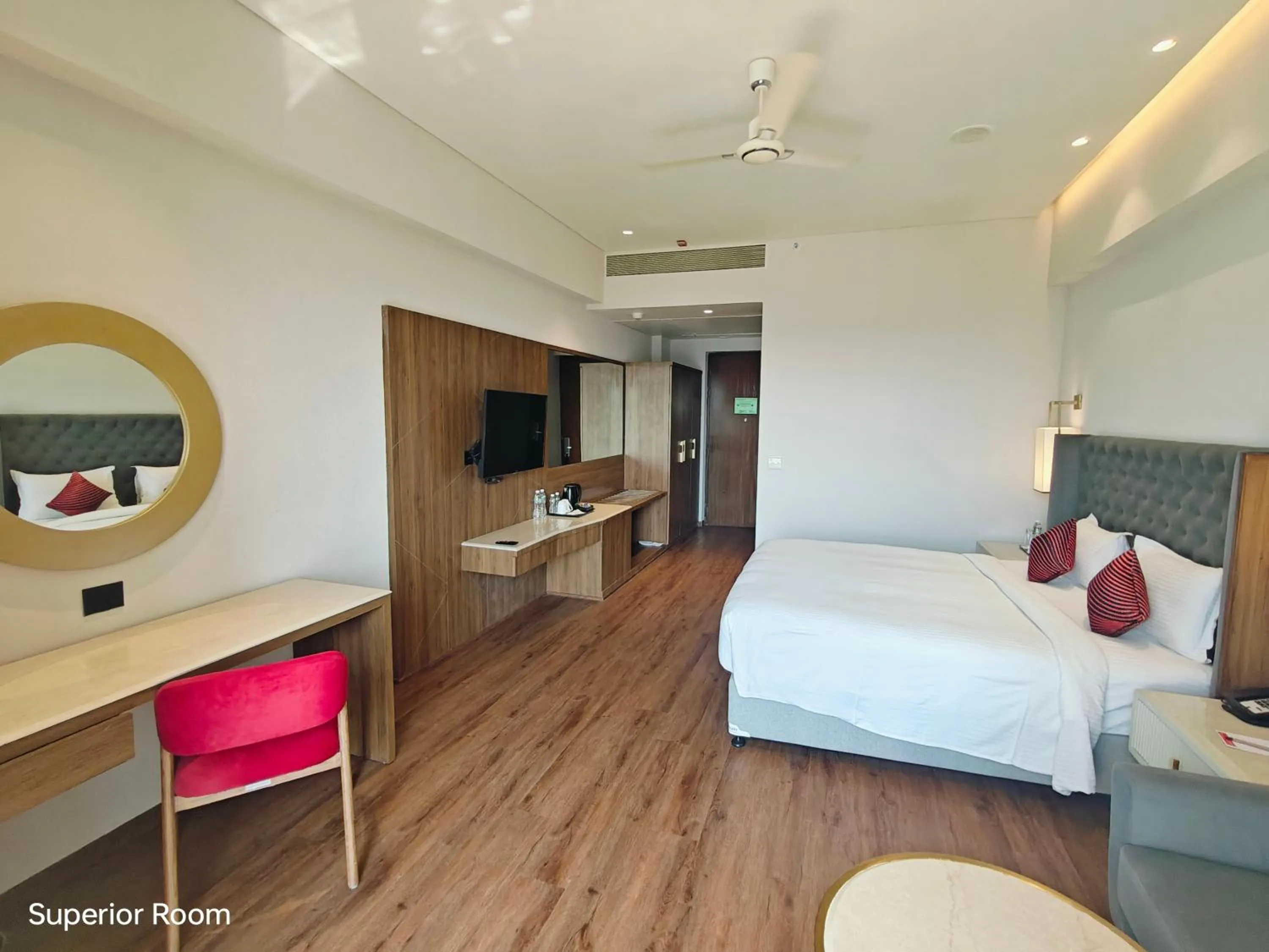 Seating area, Bed in Ramada by Wyndham Ahmedabad Narendra Modi Stadium Motera
