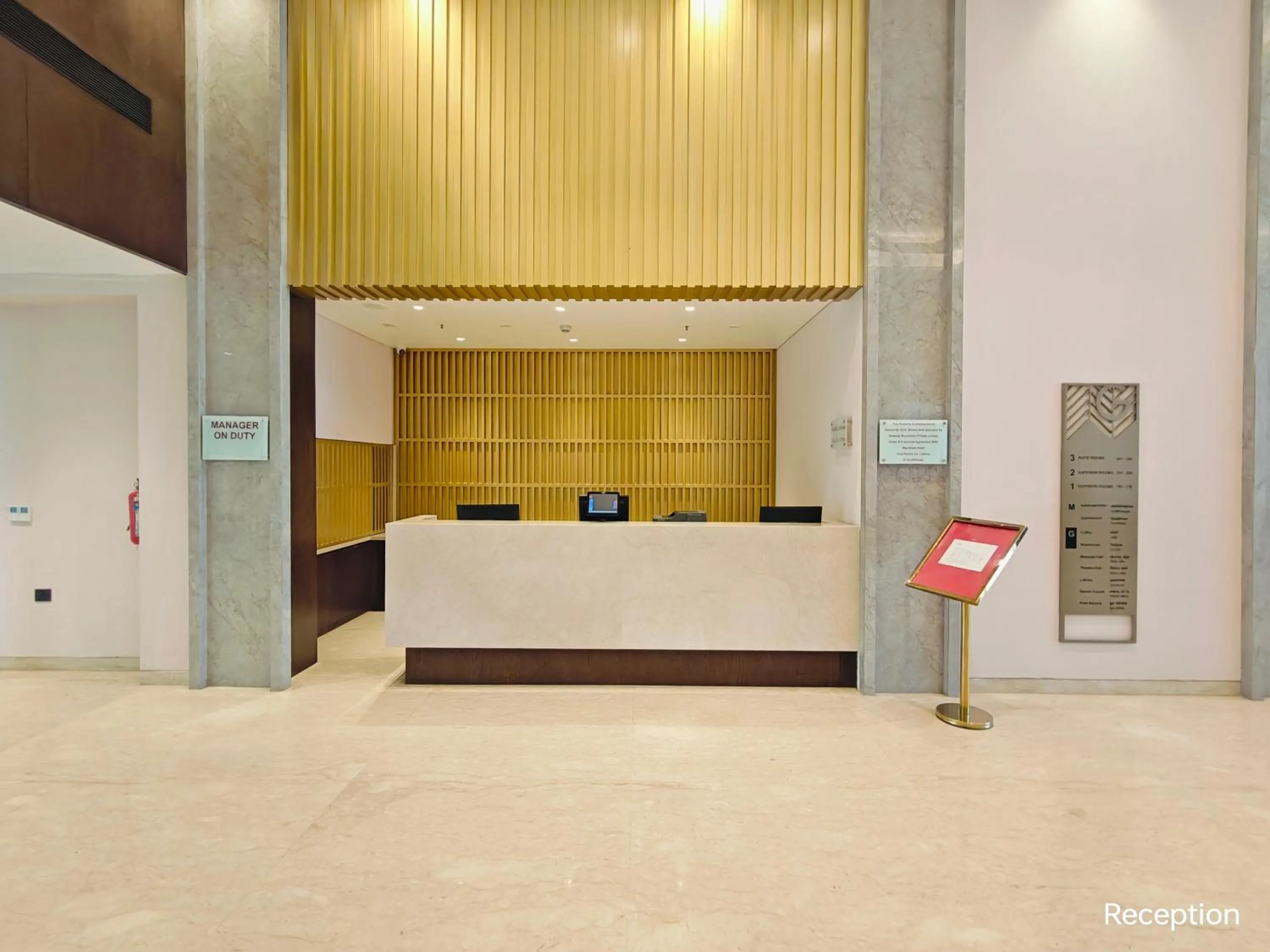 Lobby or reception in Ramada by Wyndham Ahmedabad Narendra Modi Stadium Motera