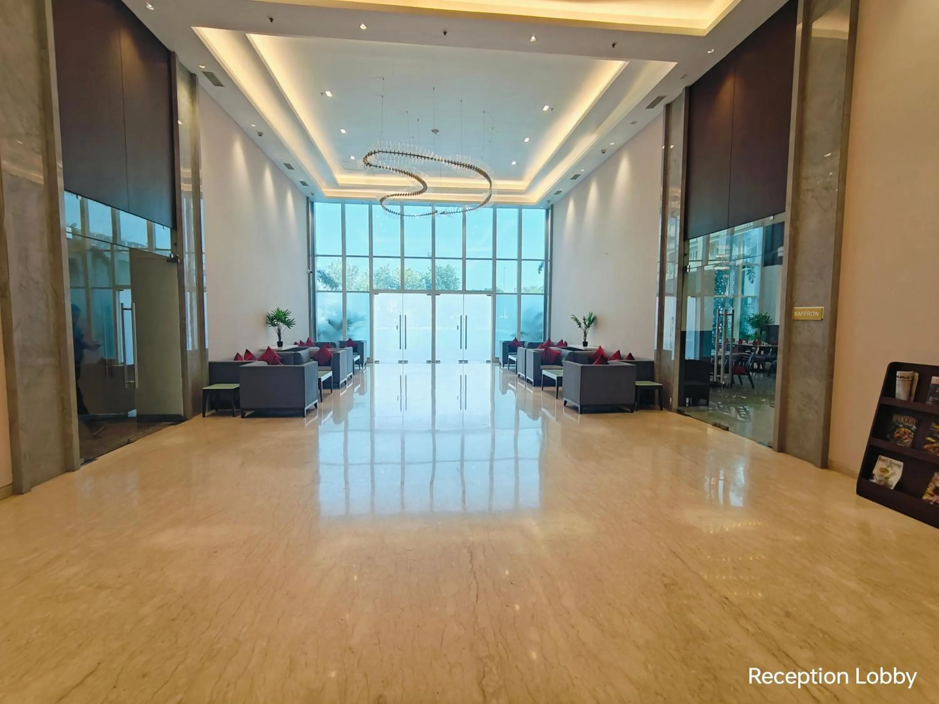 Seating area in Ramada by Wyndham Ahmedabad Narendra Modi Stadium Motera