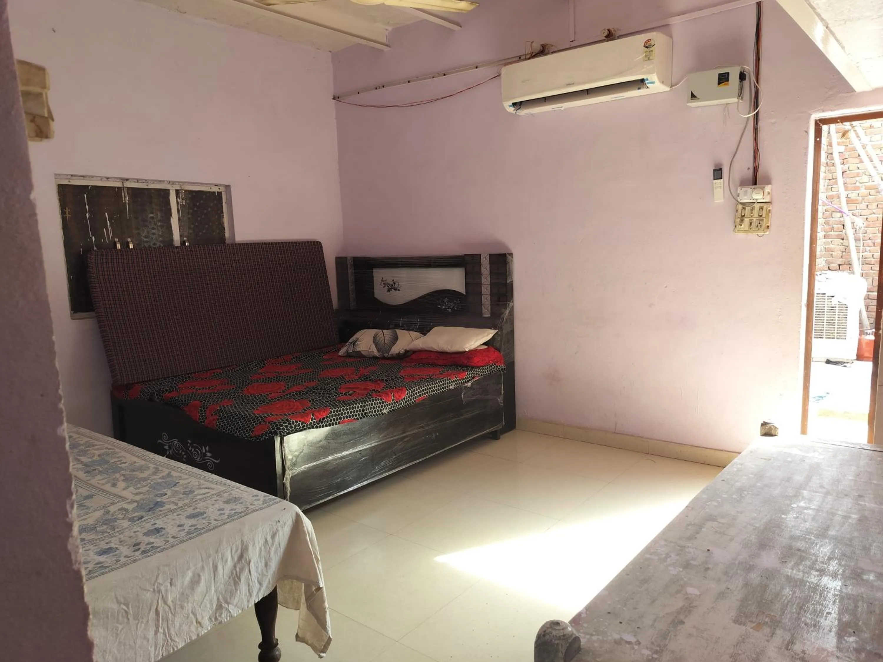Bed in Shri Krishna Kunj homestay