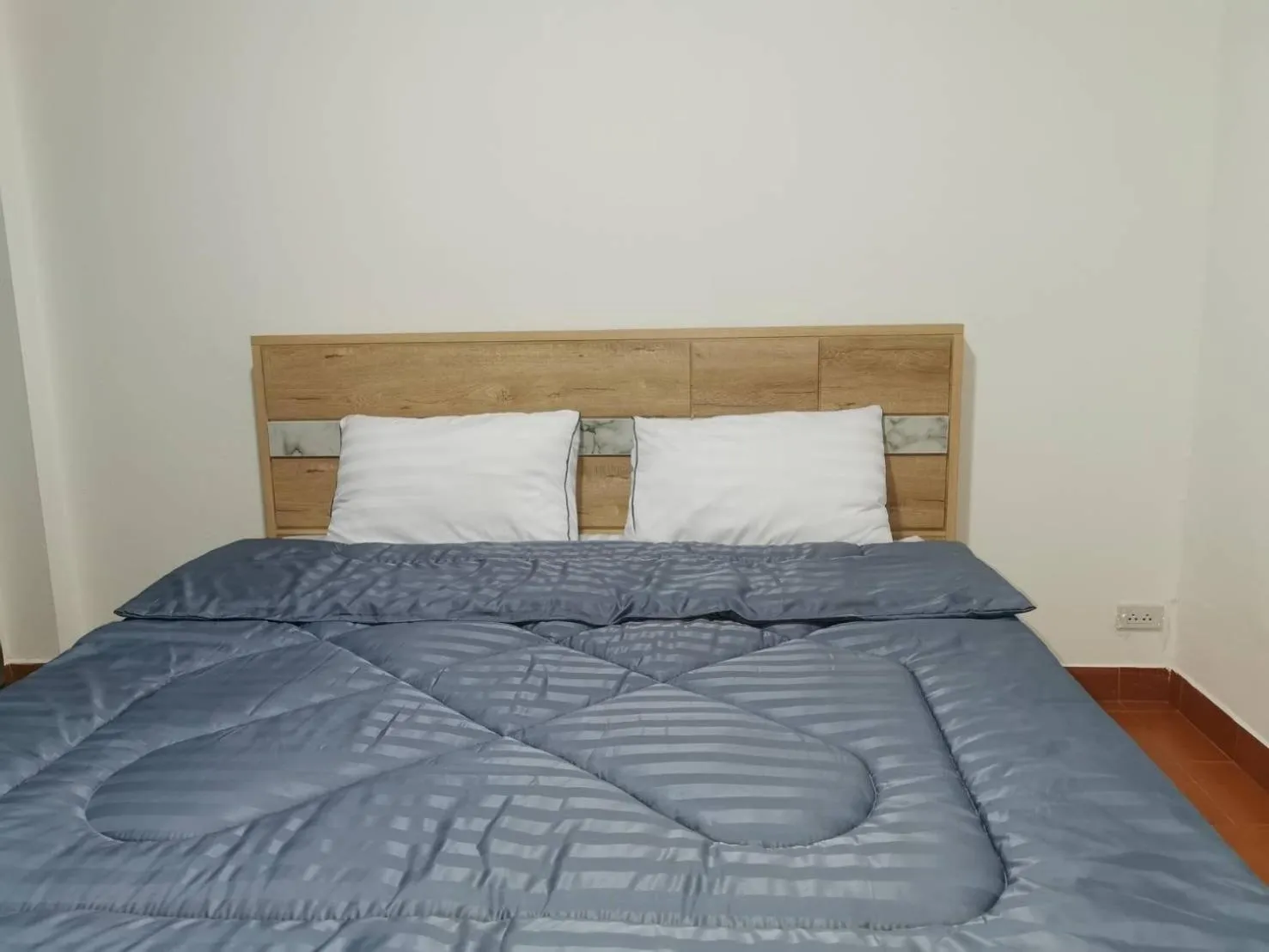 Bed in Ratanasiri Hotel