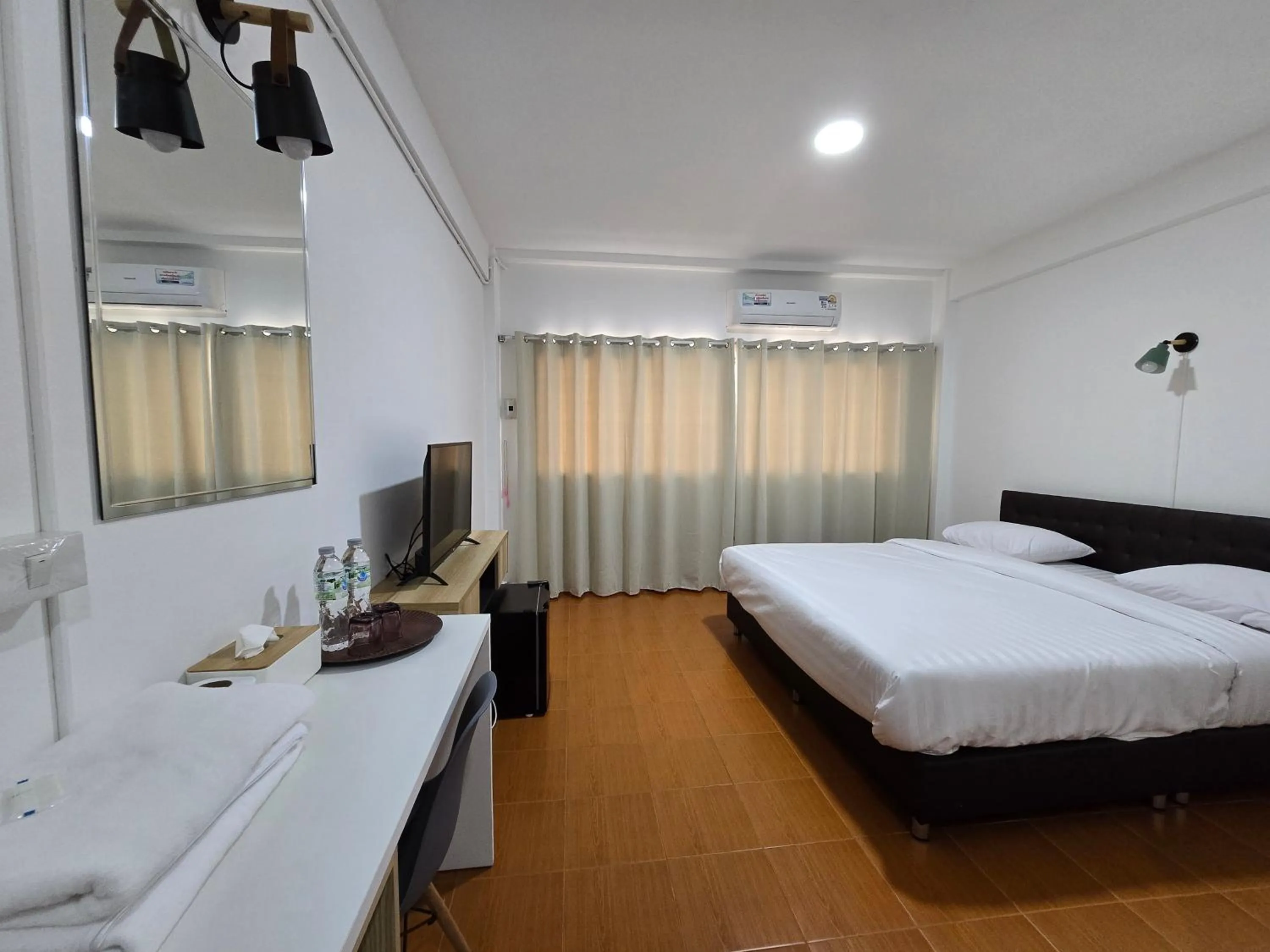 Bed in Ratanasiri Hotel