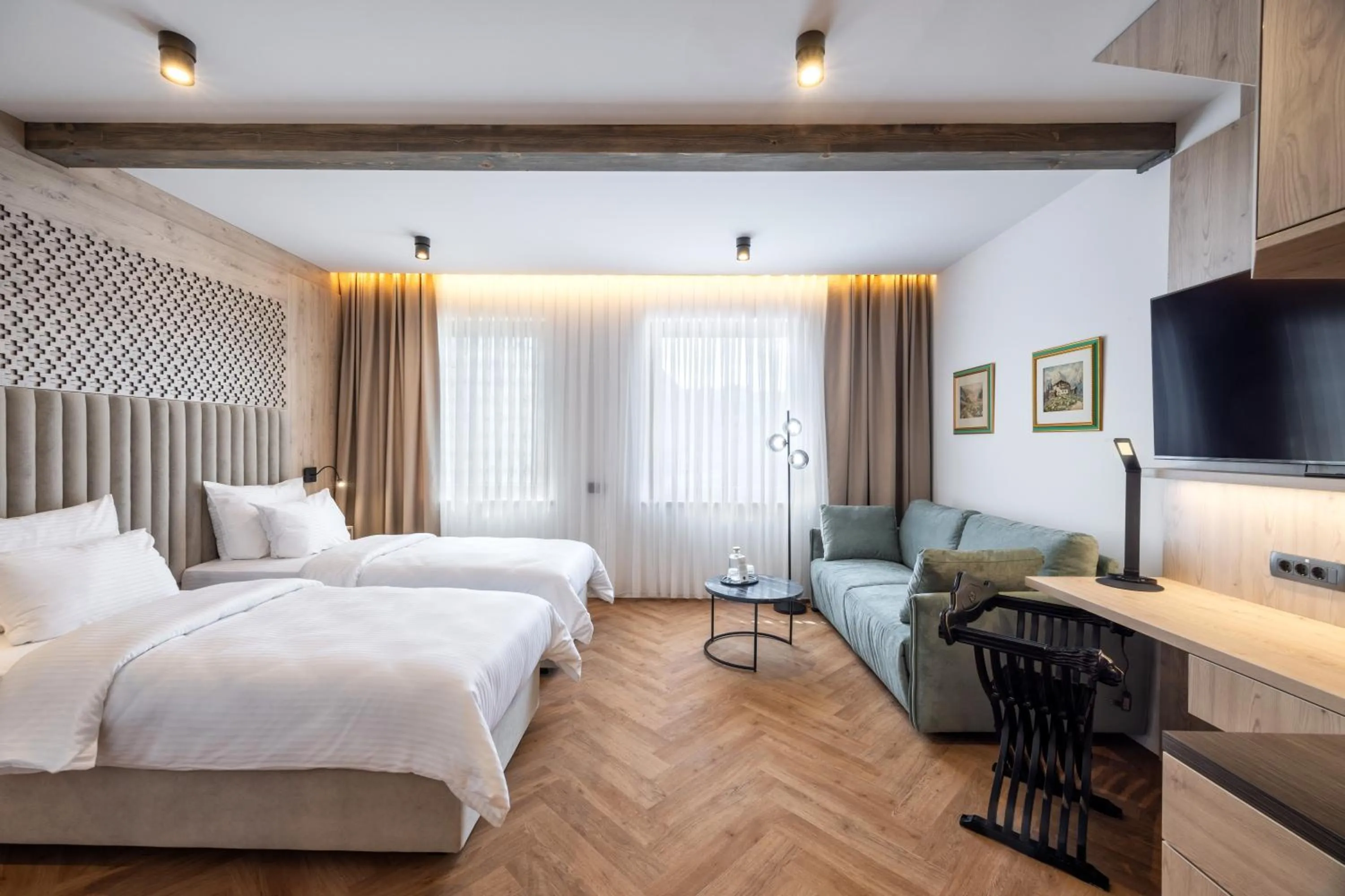 Living room, Bed in Hotel Julian Alps