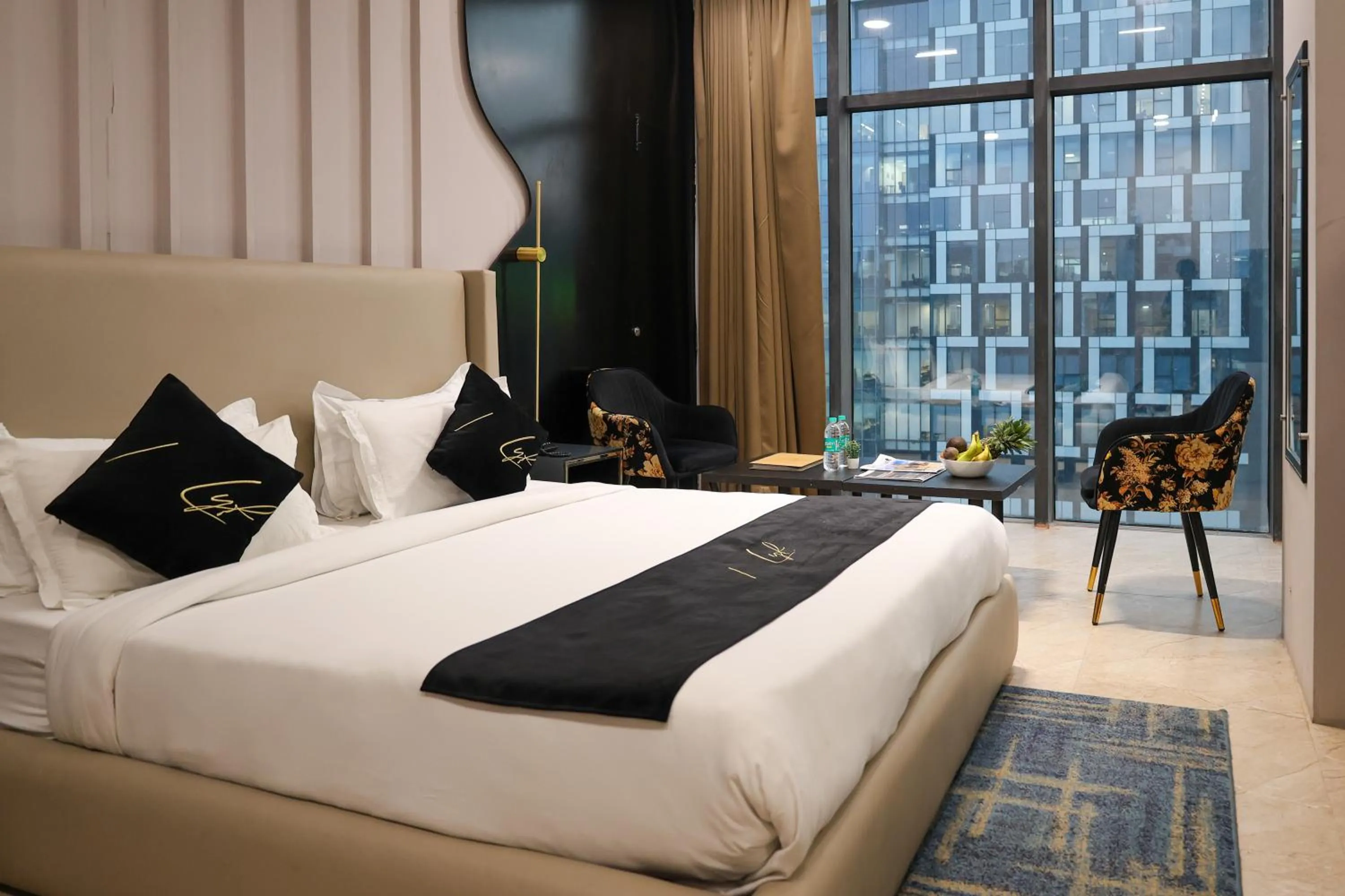 Photo of the whole room, Bed in Aquila Grand Suites - Noida Sector 136