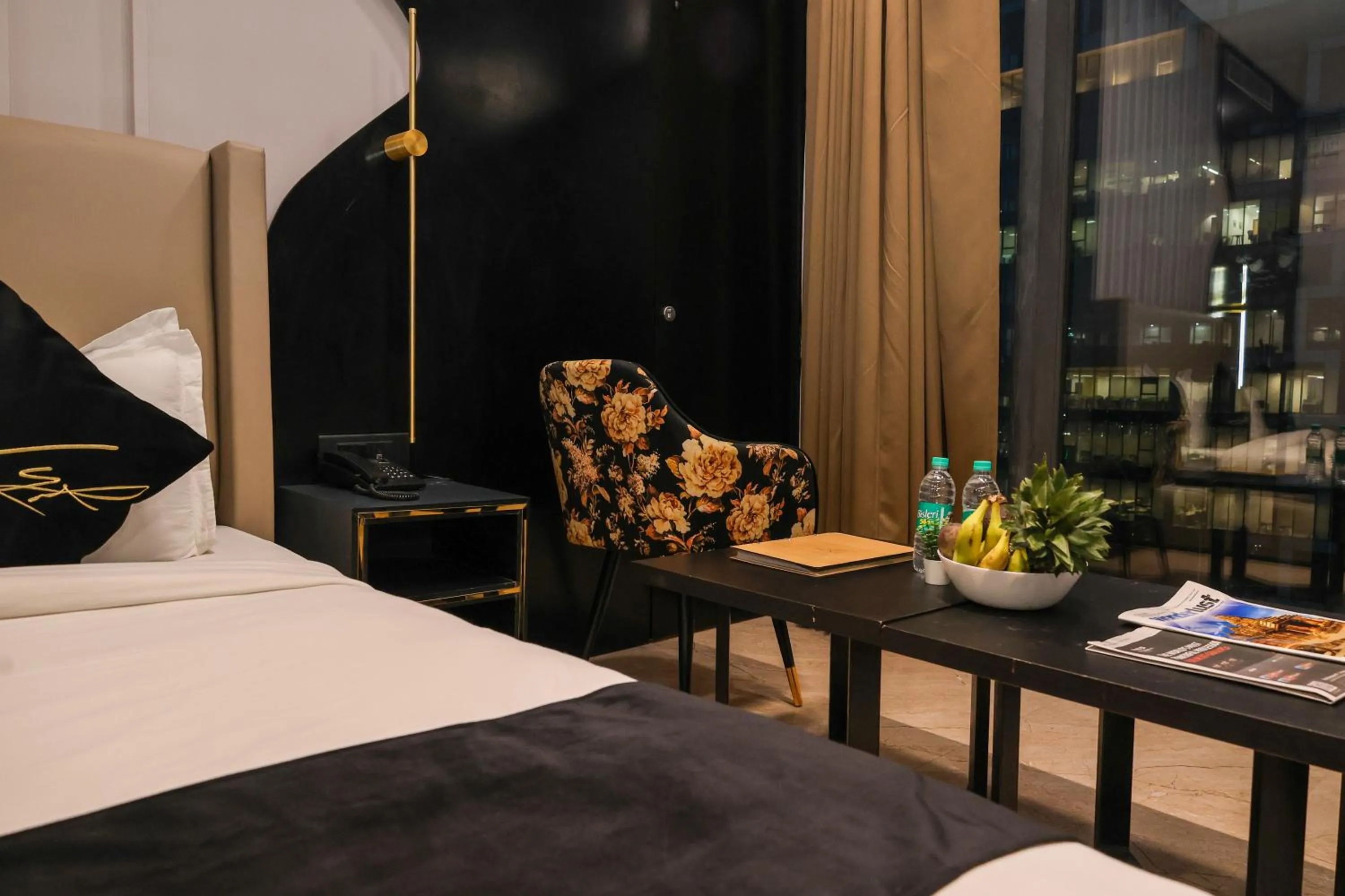 Seating area, Bed in Aquila Grand Suites - Noida Sector 136