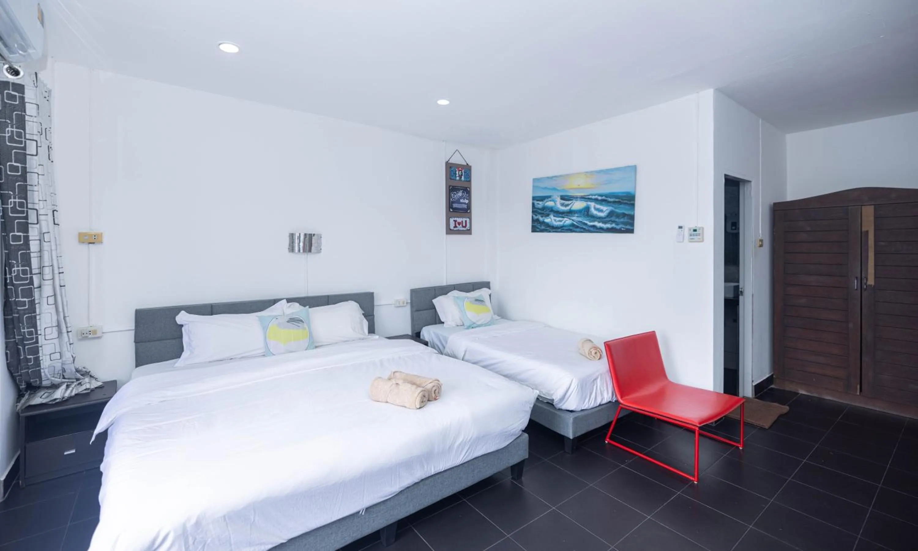 Bed in Belle Cose Guest House Phuket