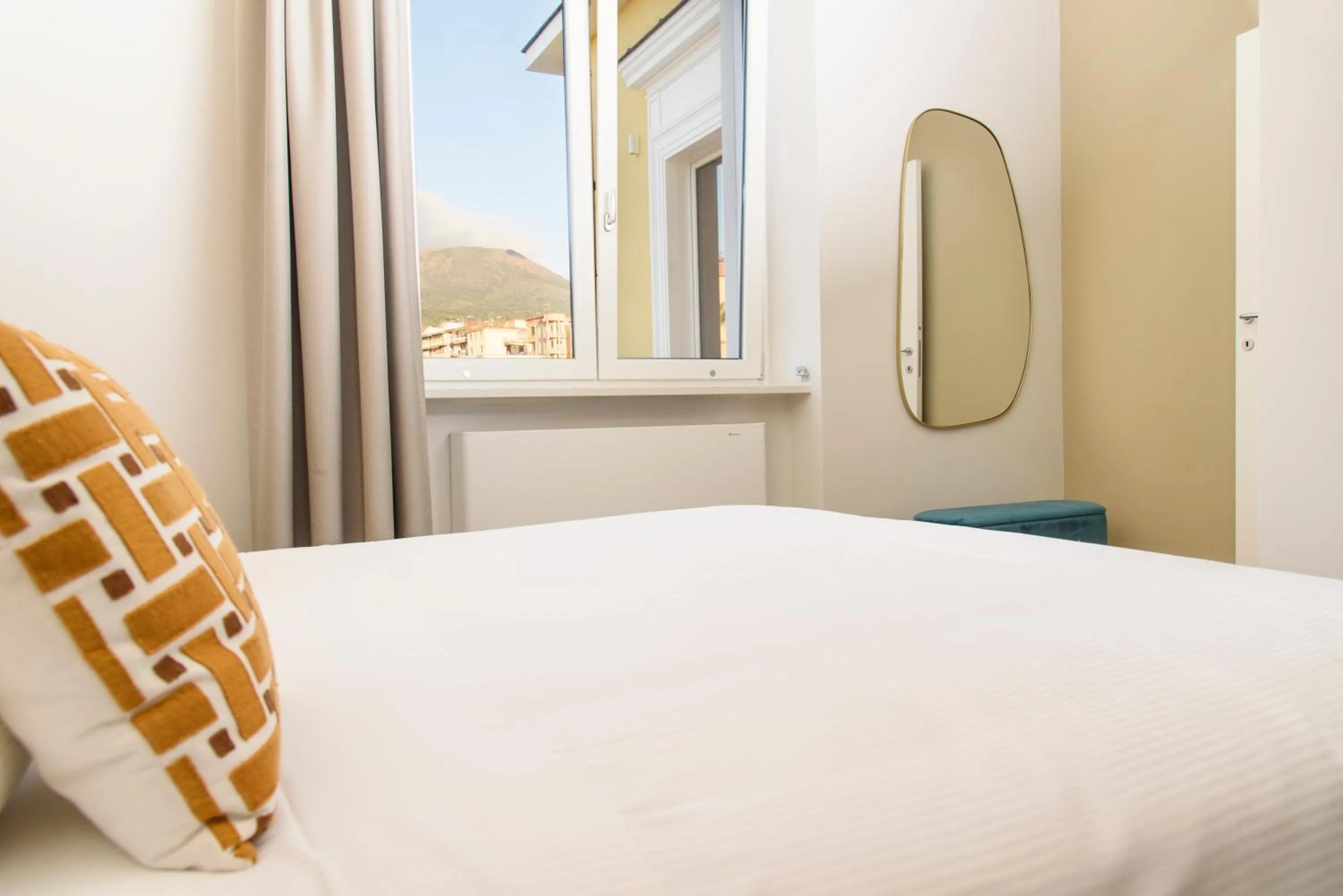 Bed in Vesuvius Palace Aparthotel