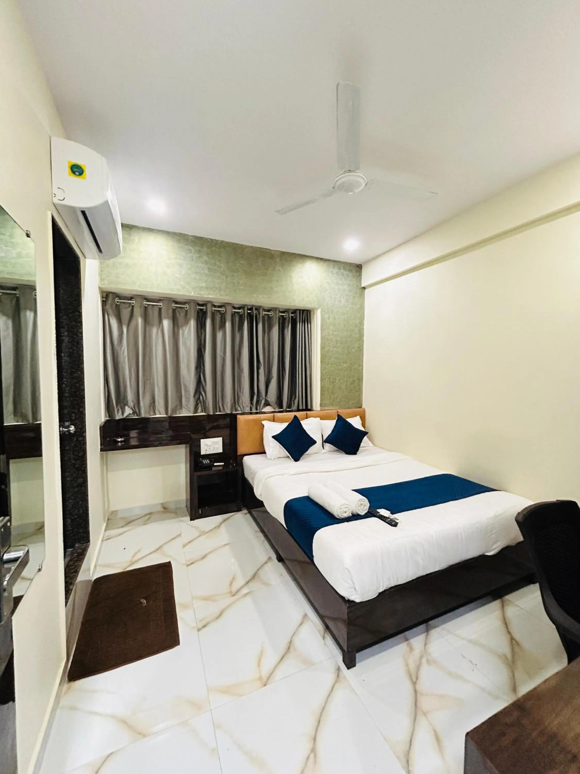 Communal lounge/ TV room, Bed in Hotel Rinza Residency