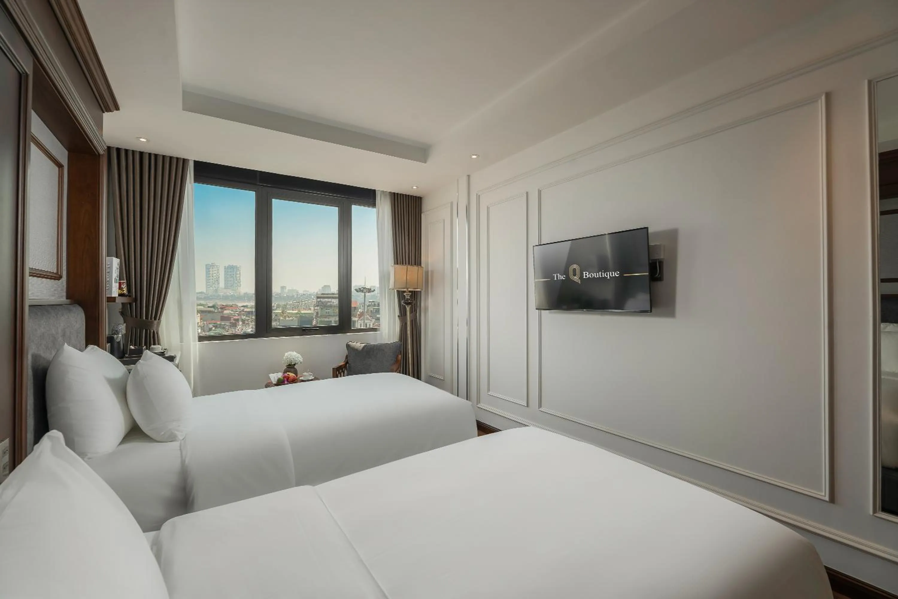 Bed in The Q Boutique Hotel