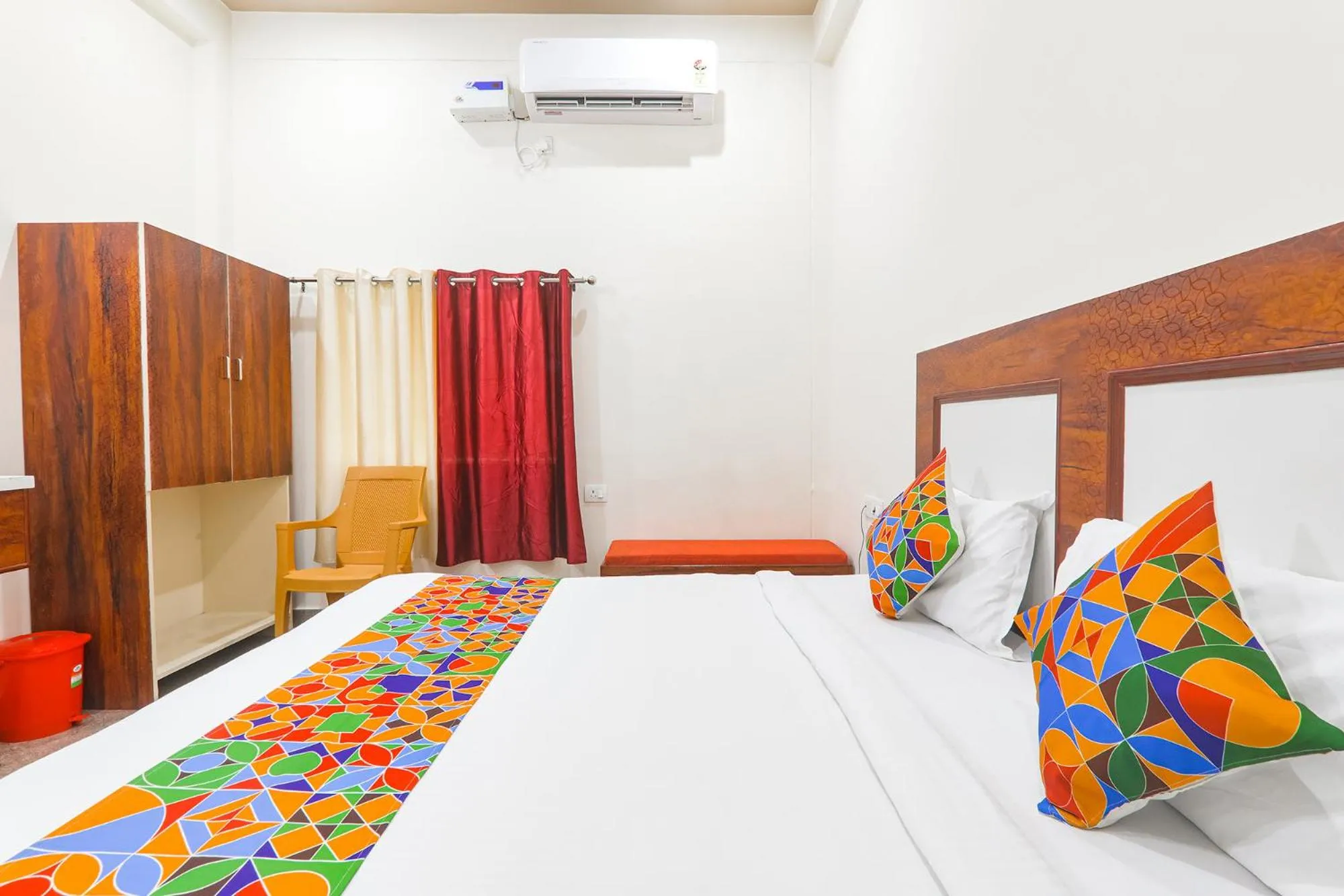 Bed in FabHotel Shree Venkatesh Nileyam