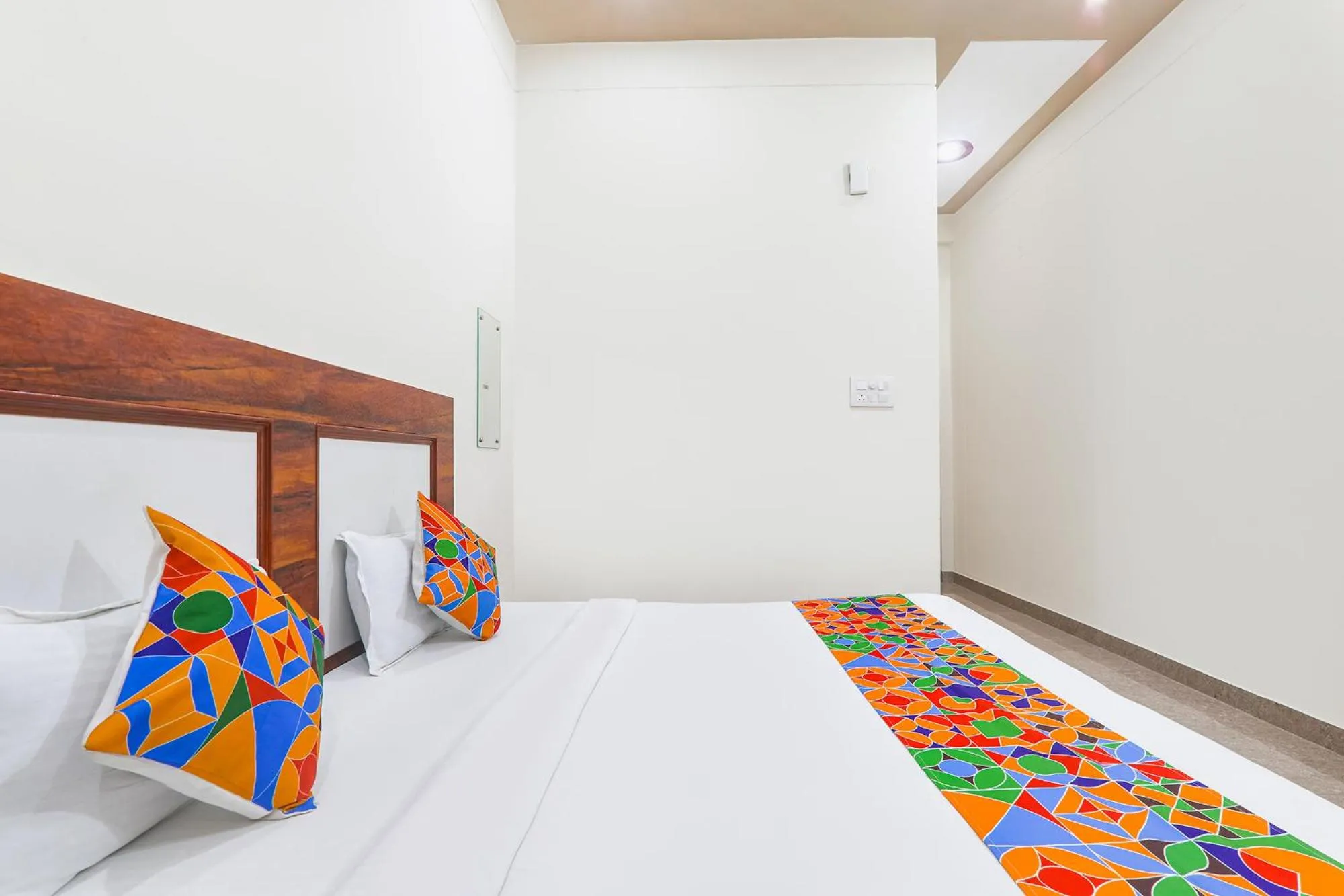 Bed in FabHotel Shree Venkatesh Nileyam