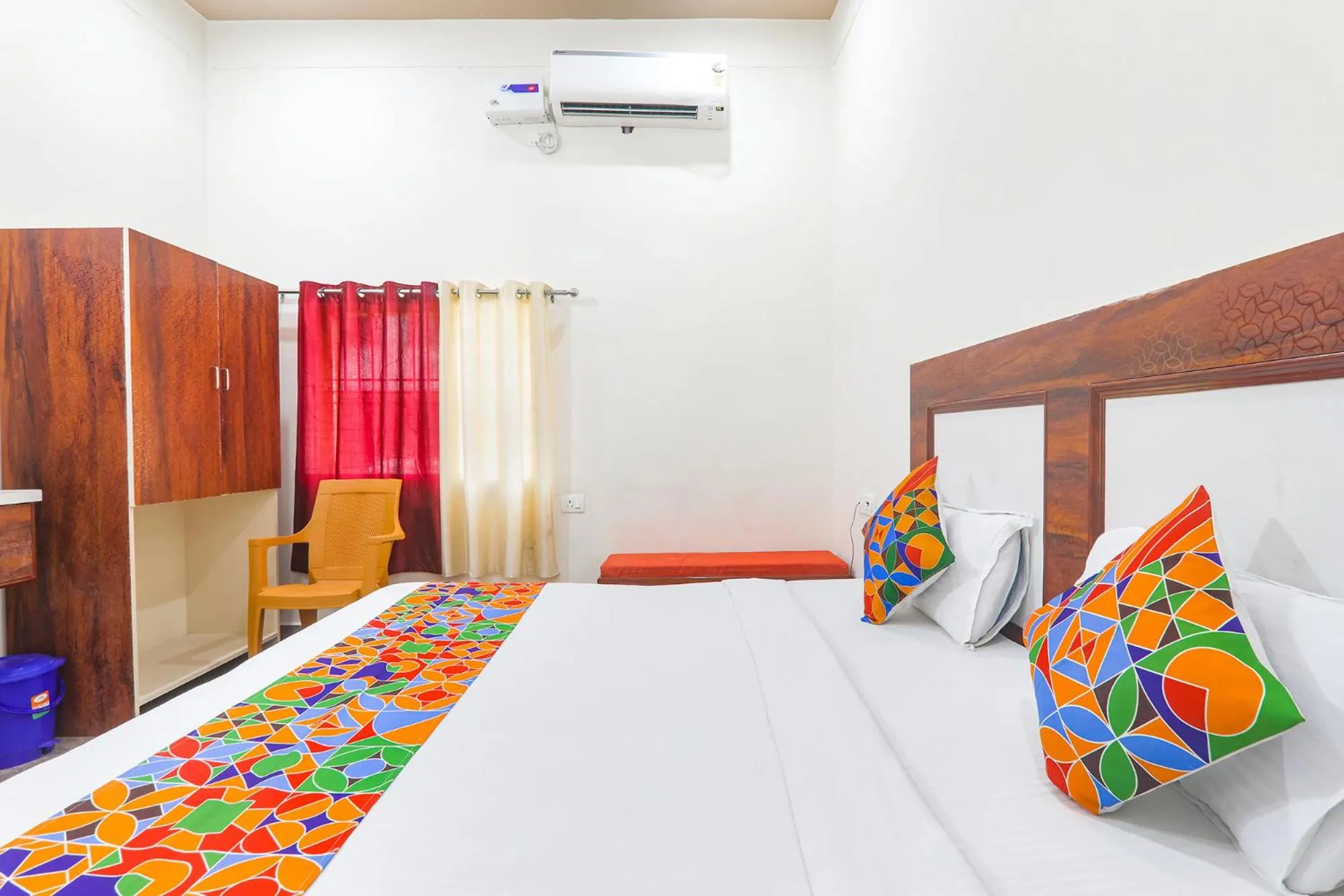 Bed in FabHotel Shree Venkatesh Nileyam