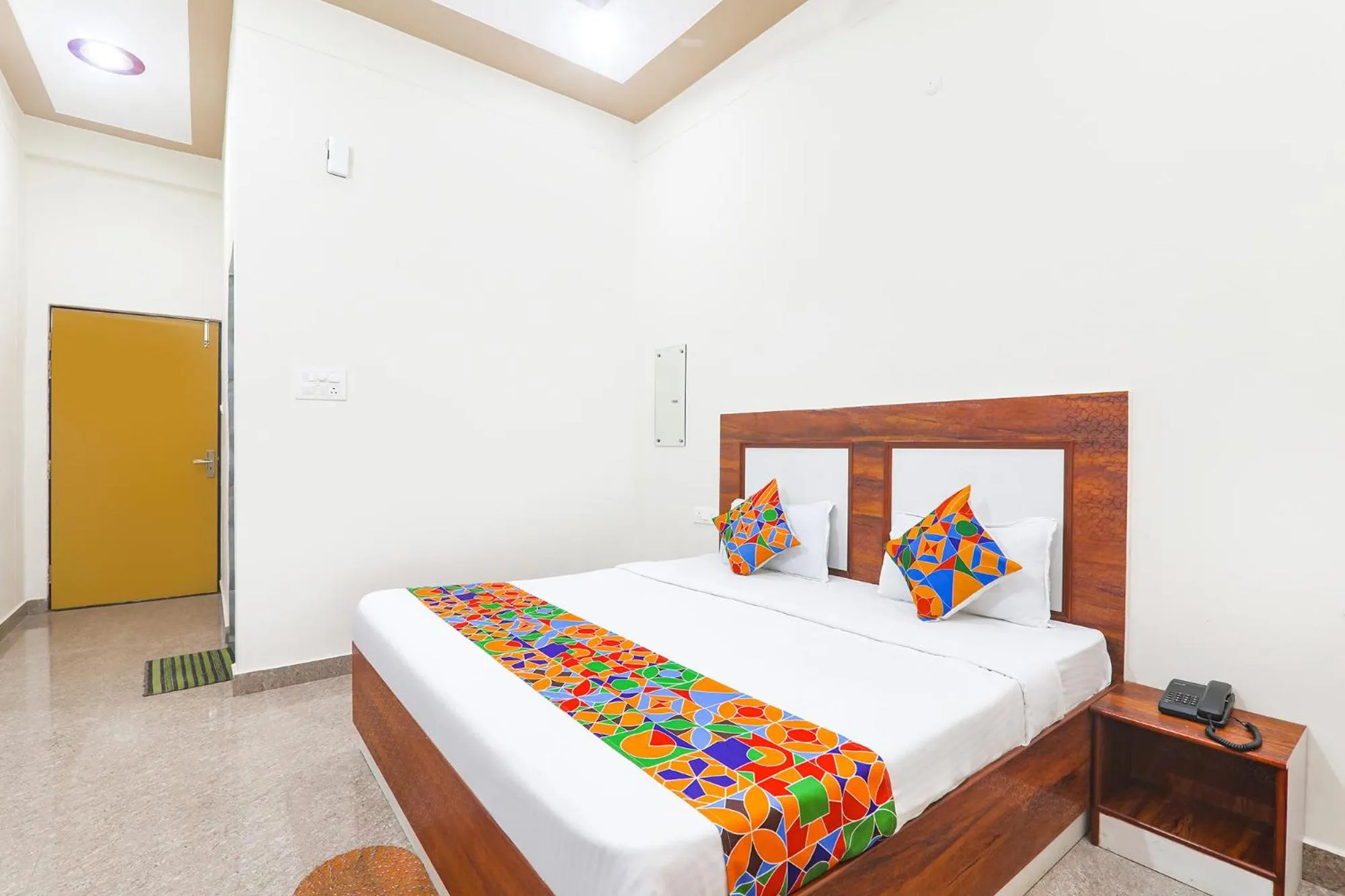 Bed in FabHotel Shree Venkatesh Nileyam