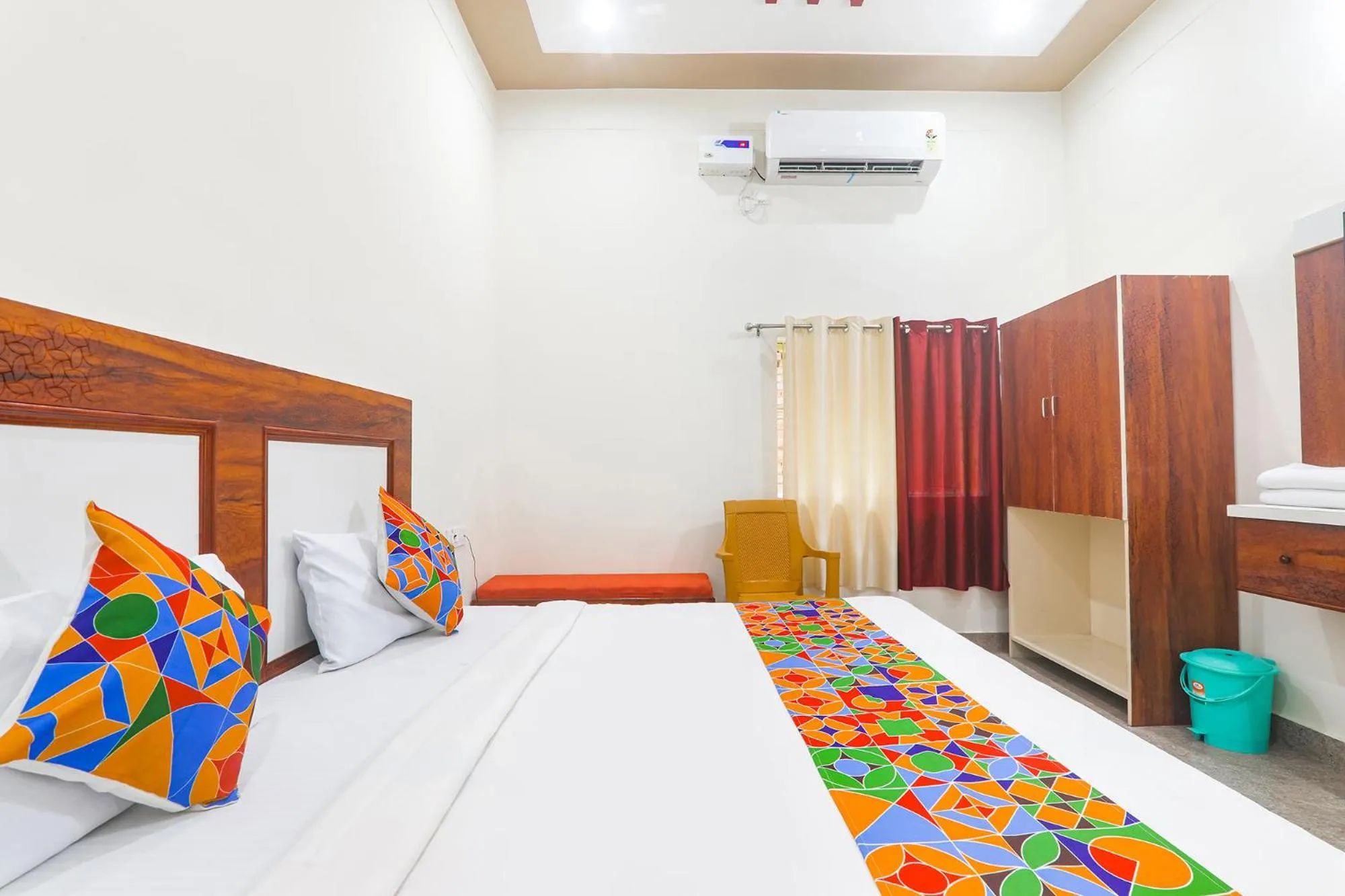 Bed in FabHotel Shree Venkatesh Nileyam