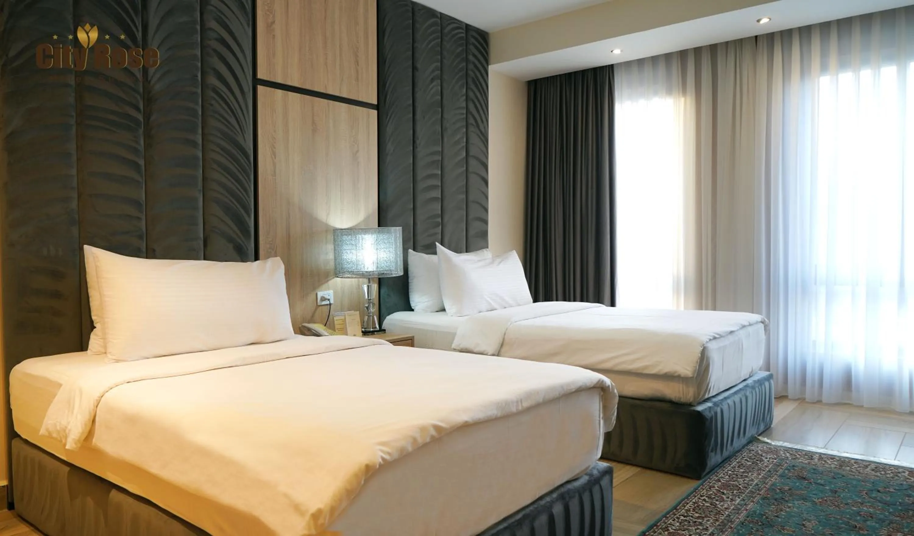 Bed in City Rose Hotel Suites