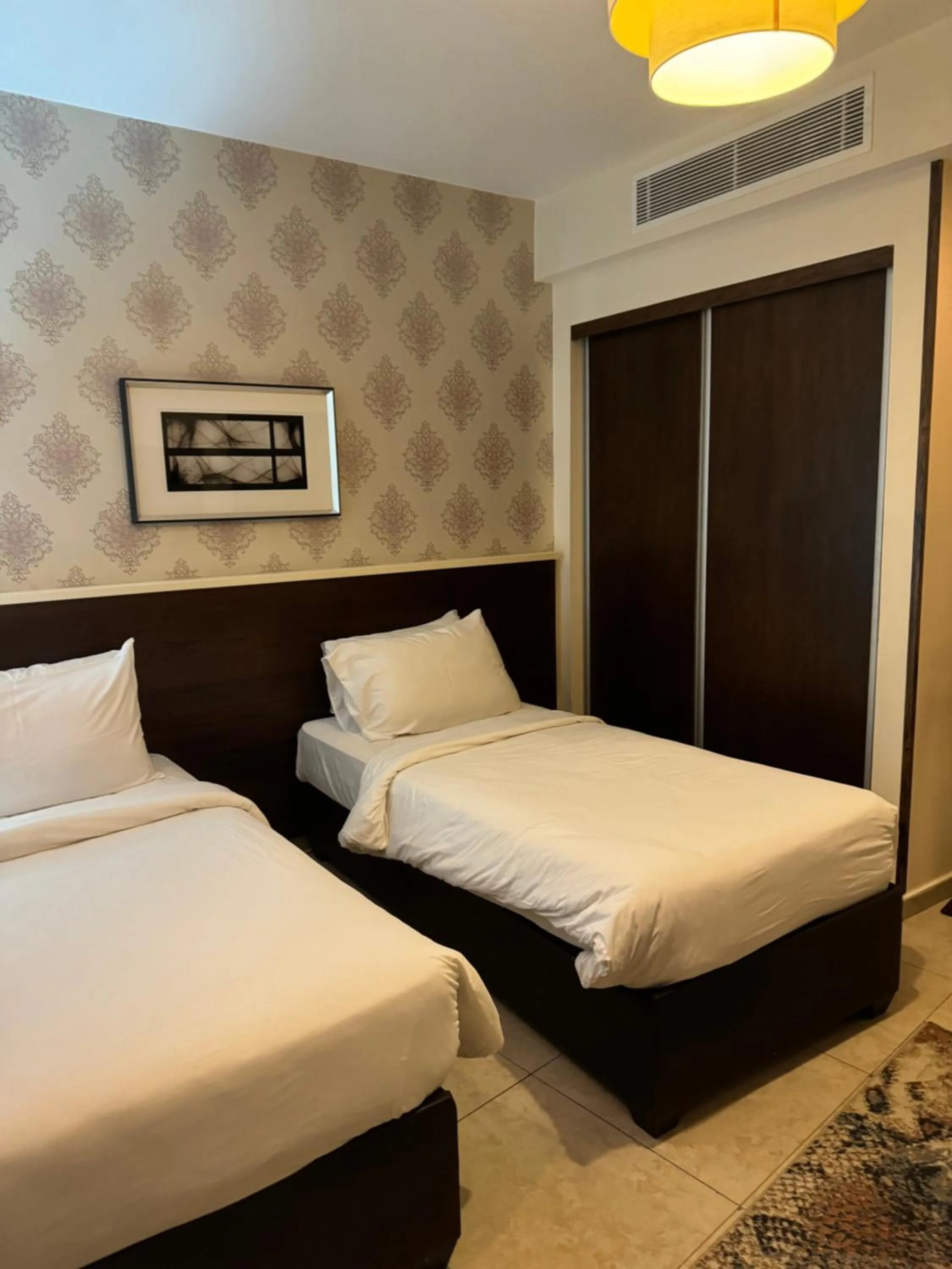 Bed in City Rose Hotel Suites