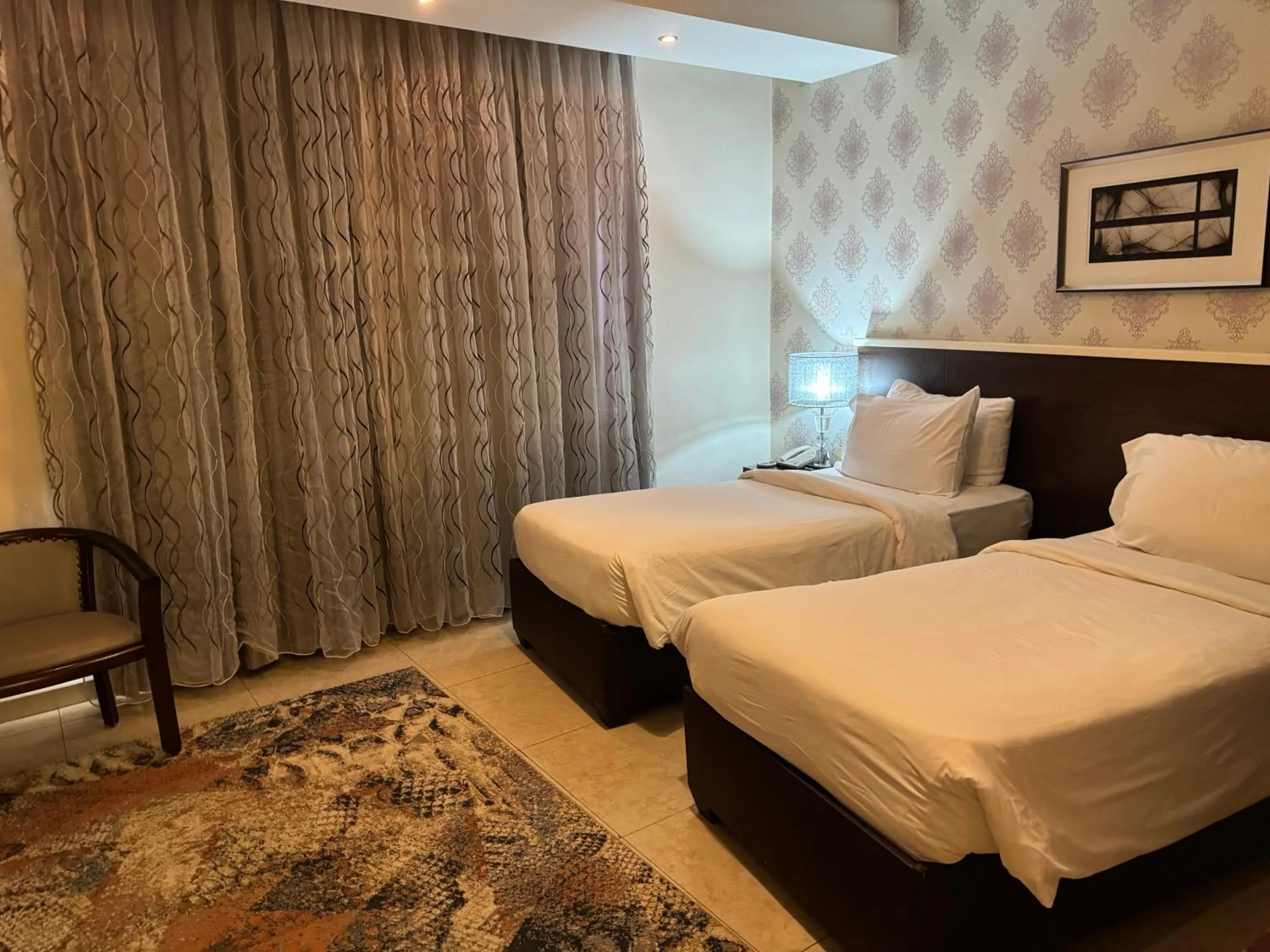 Bed in City Rose Hotel Suites