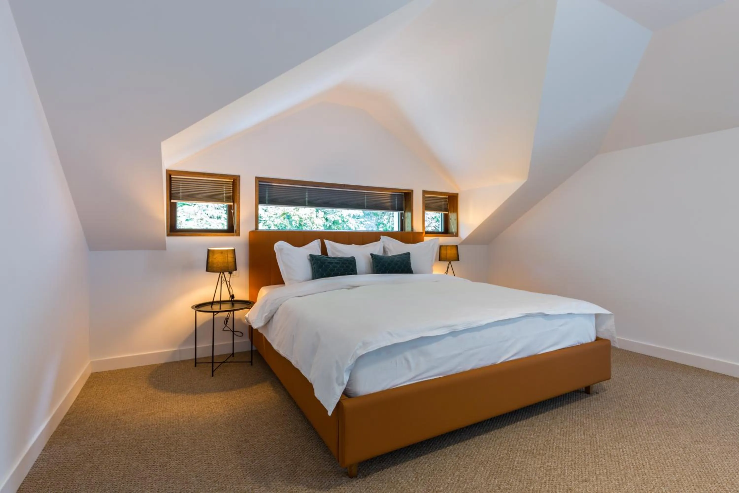 Bed in UpperHouse Suites & More